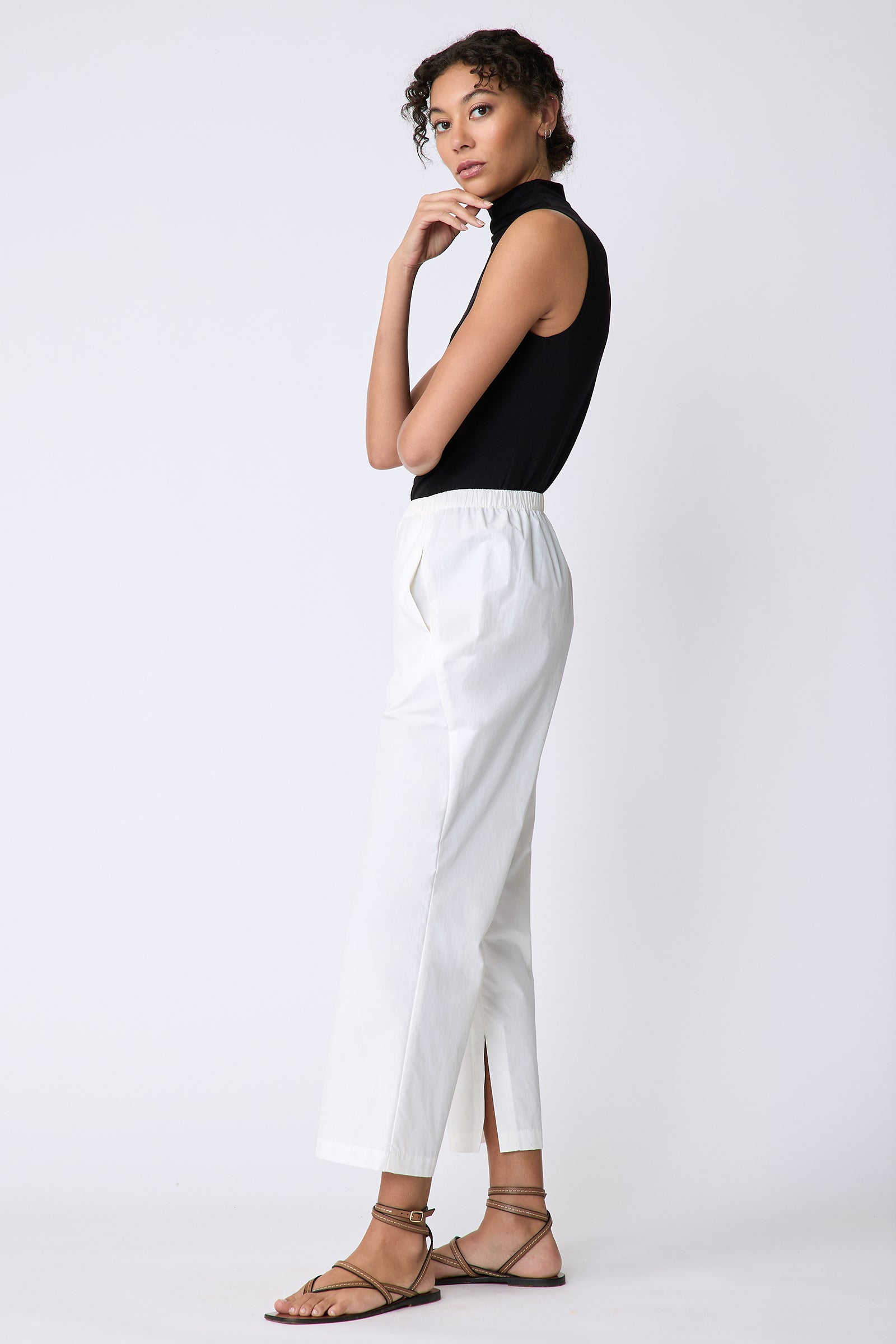 Kal Rieman Split Hem Capri in Ecru Broadcloth on model side view arm crossed in front hand on chin