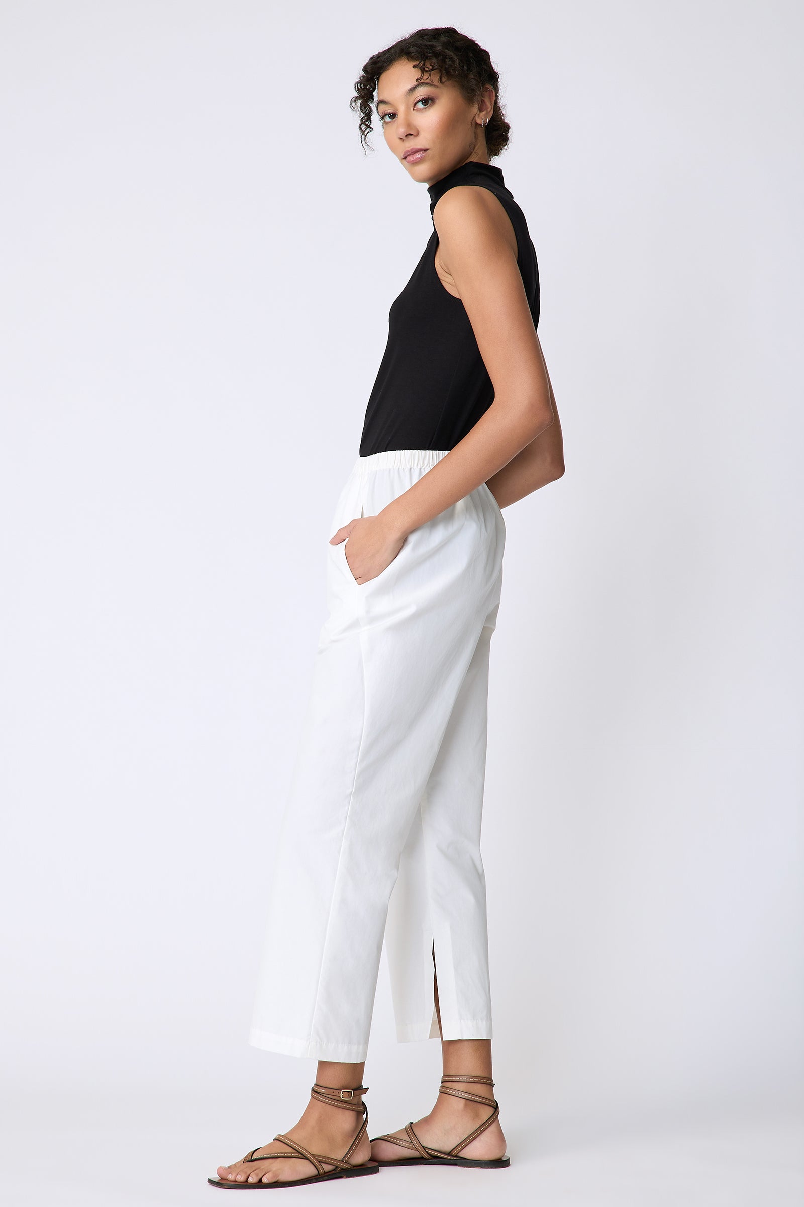 Kal Rieman Split Hem Capri in Ecru Broadcloth on model side view hands in pockets