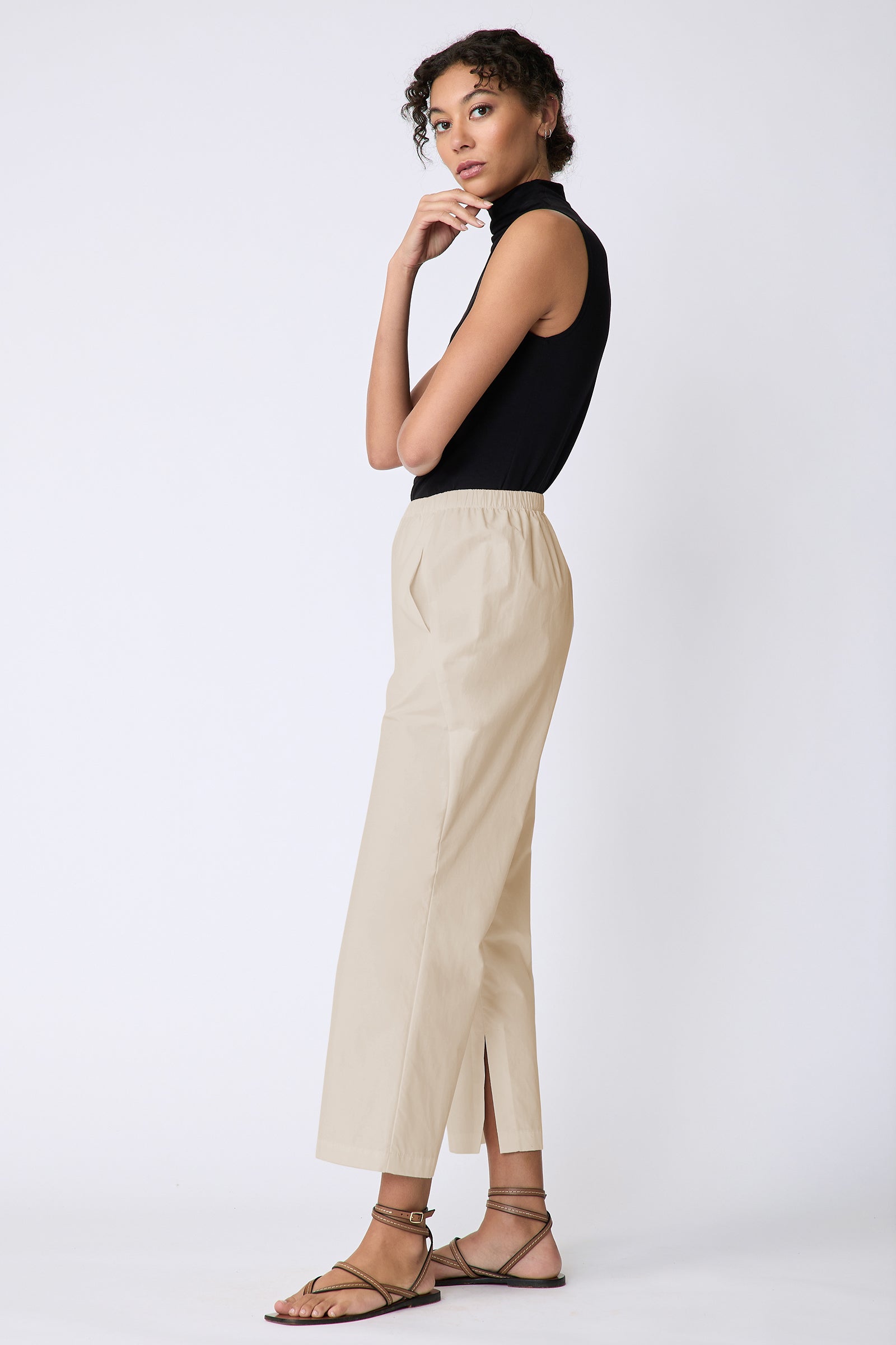 Kal Rieman Split Hem Capri in Sand Broadcloth on model side view arm crossed in front hand on chin