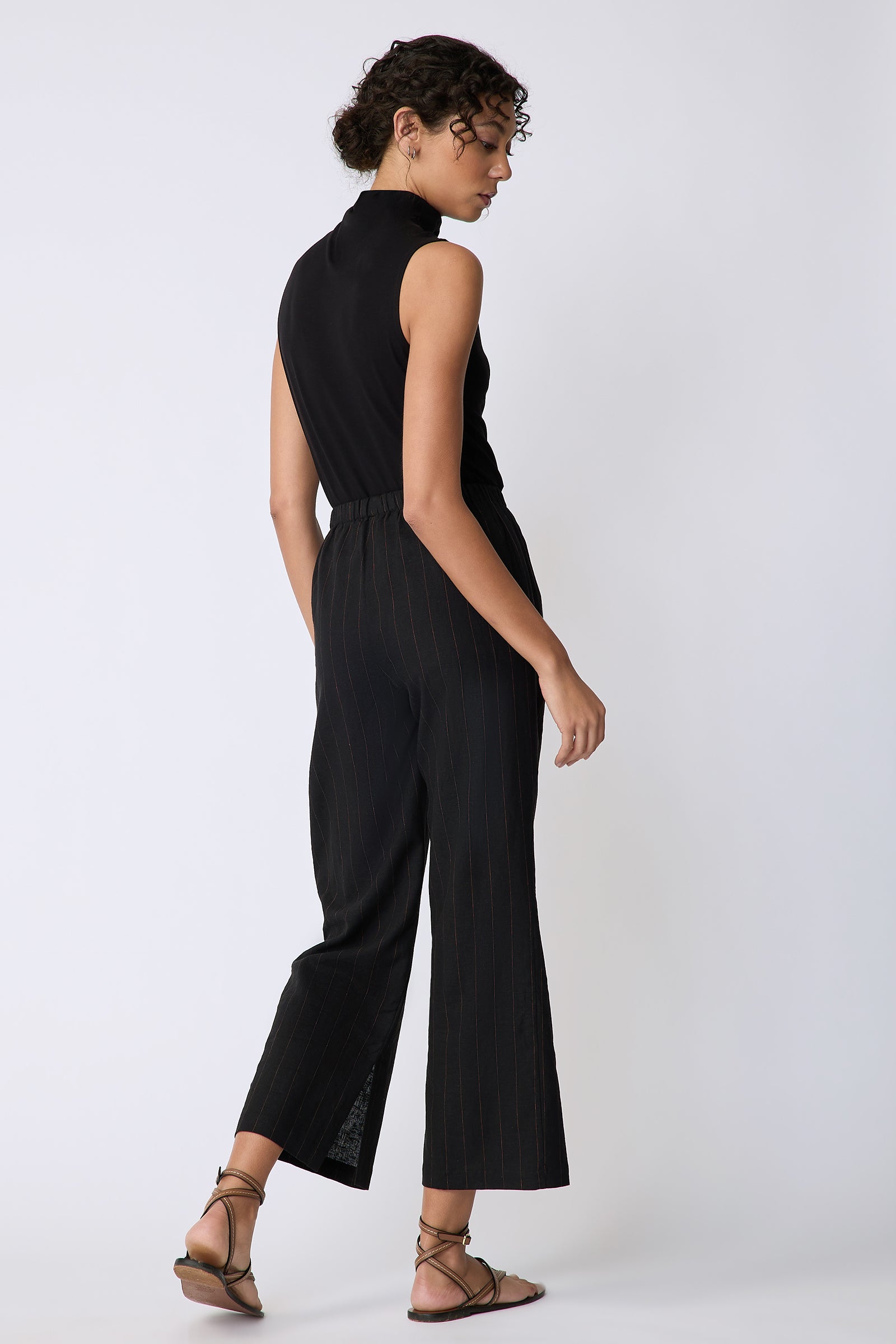 Kal Rieman Split Hem Capri in black pinstripe linen on model back view