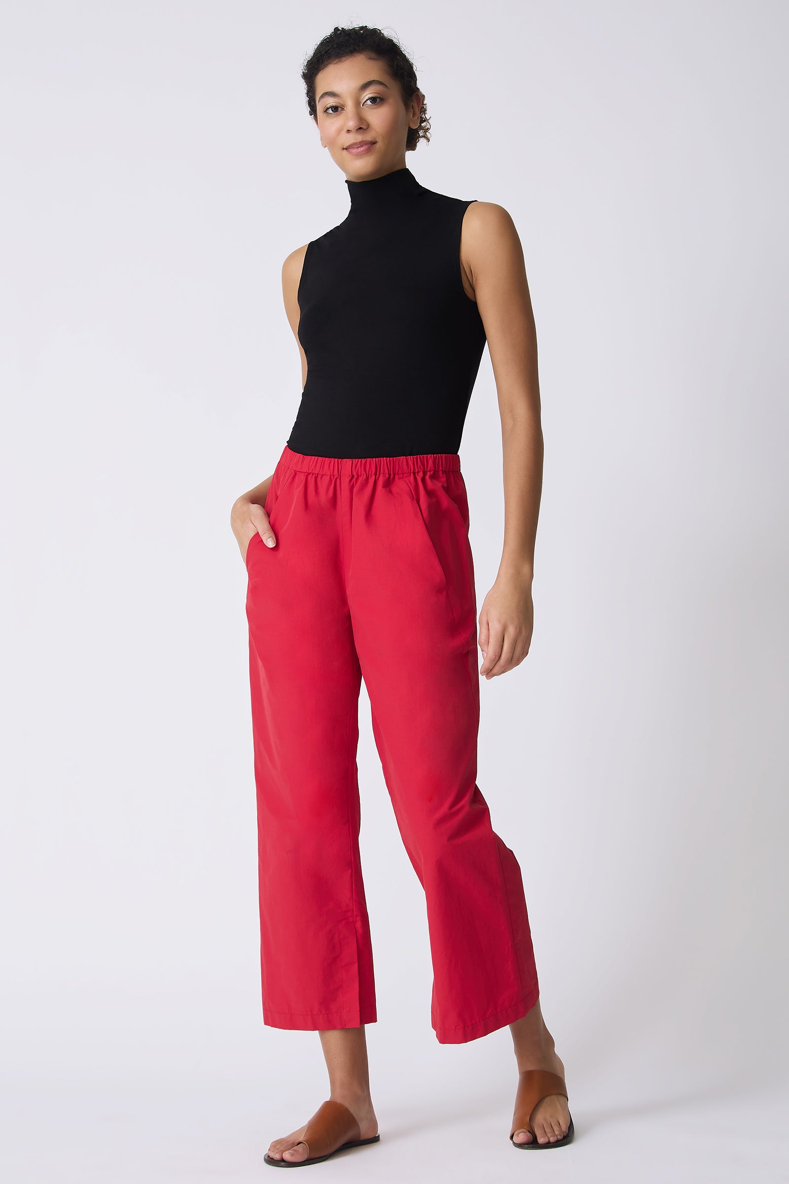 Kal Rieman Split Hem Capri in Red Broadcloth on model with hand in pocket full front view