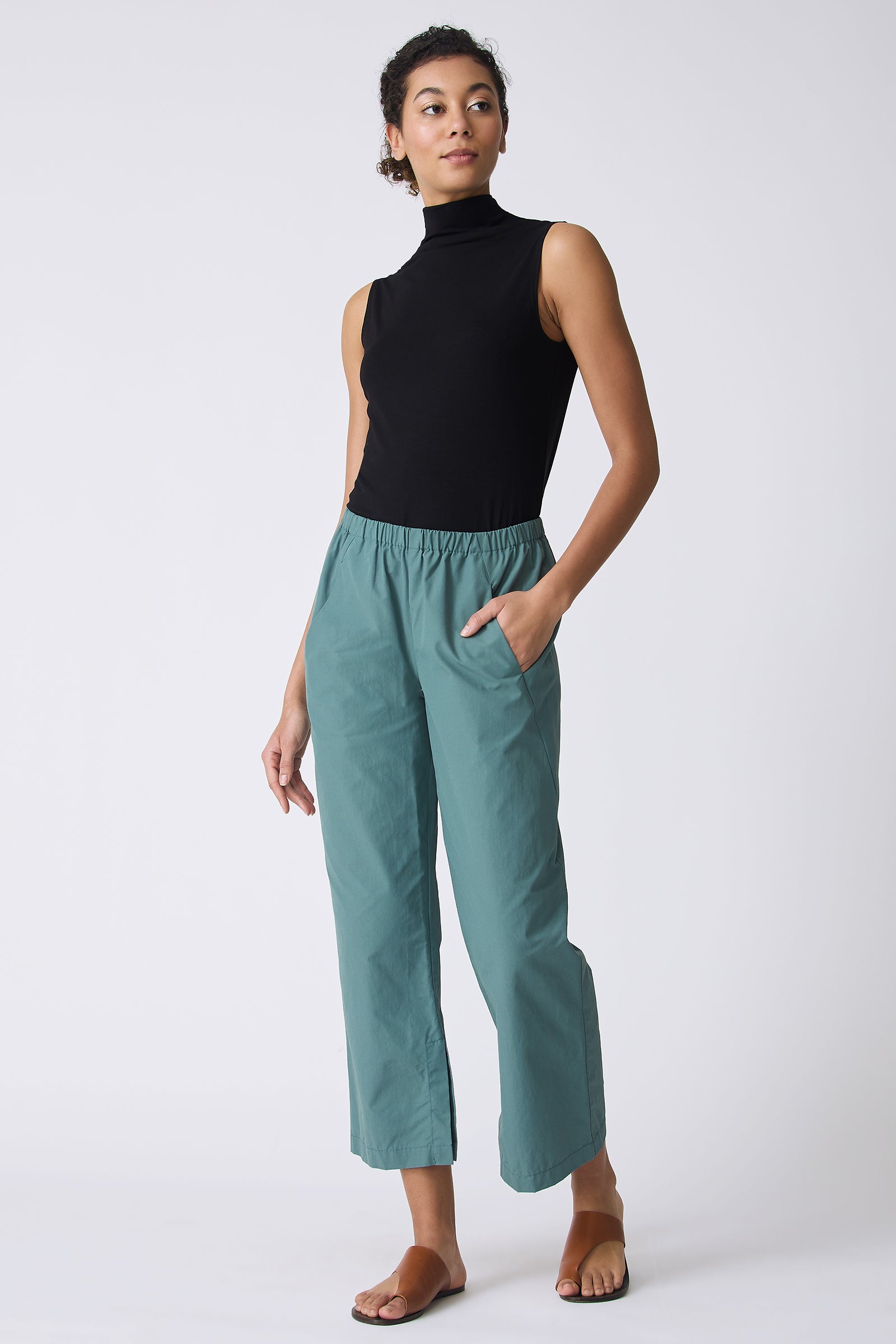 Kal Rieman Split Hem Capri in Sage Broadcloth on model with hand in pocket full front view