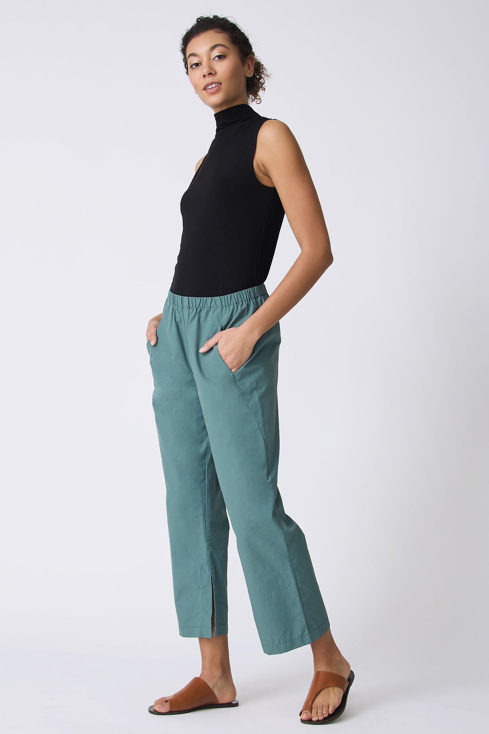 Kal Rieman Split Hem Capri in Sage Broadcloth on model walking full side view