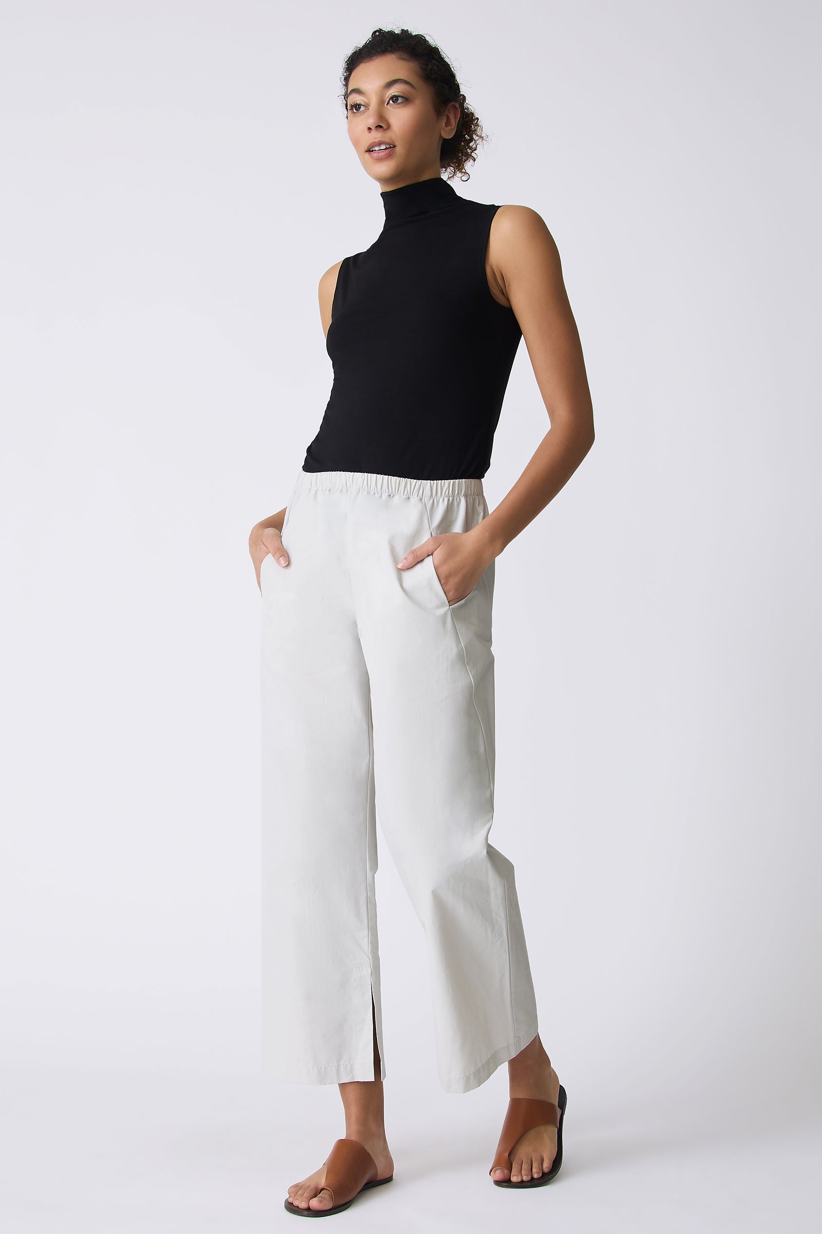 Kal Rieman Split Hemi Capri in Stone on model with hands in pockets full front view