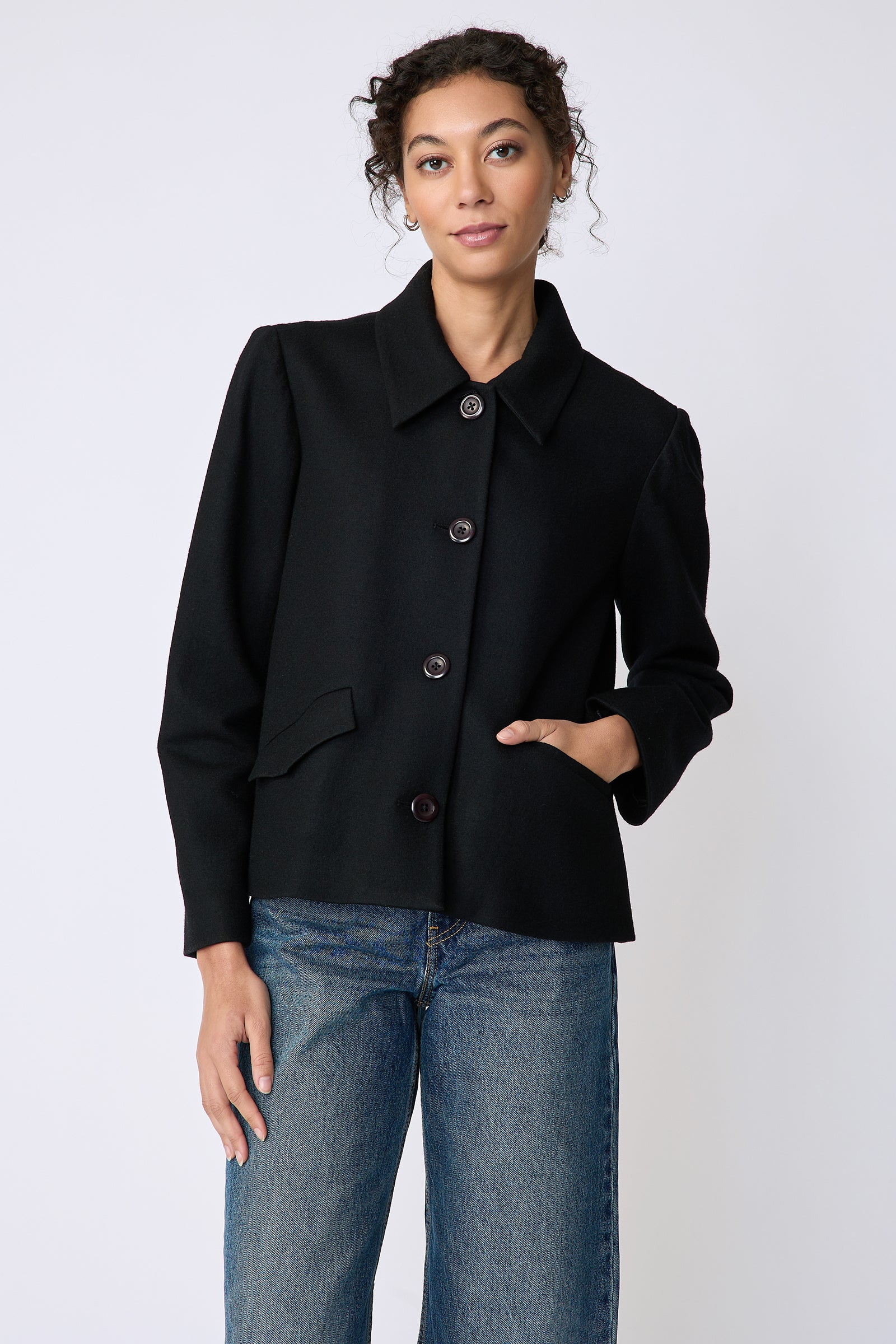 Kal Rieman Sylvie Swing Jacket in black felted jersey on model front view hand in pocket