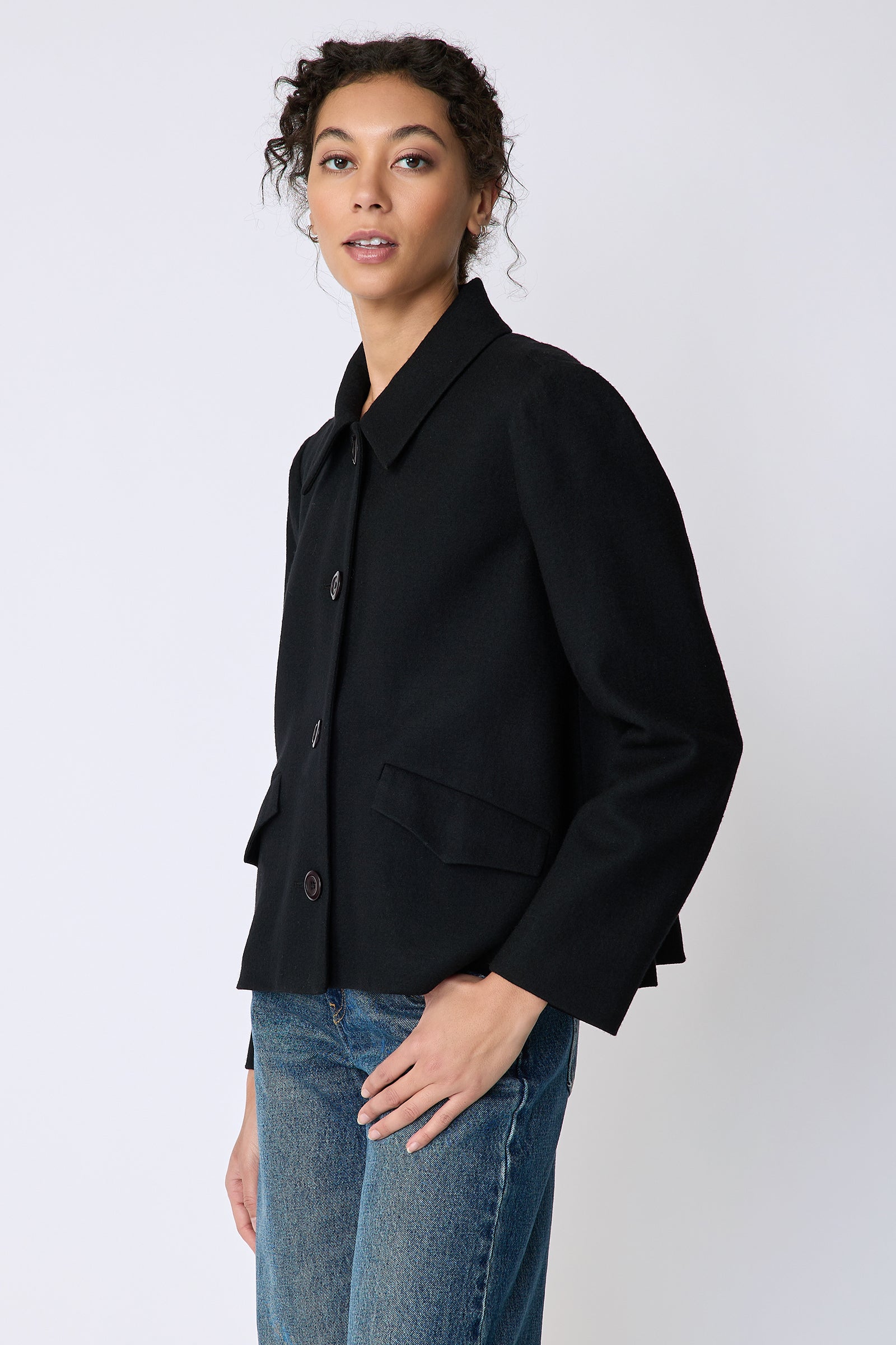 Kal Rieman Sylvie Swing Jacket in black felted jersey on model side view and in pocket
