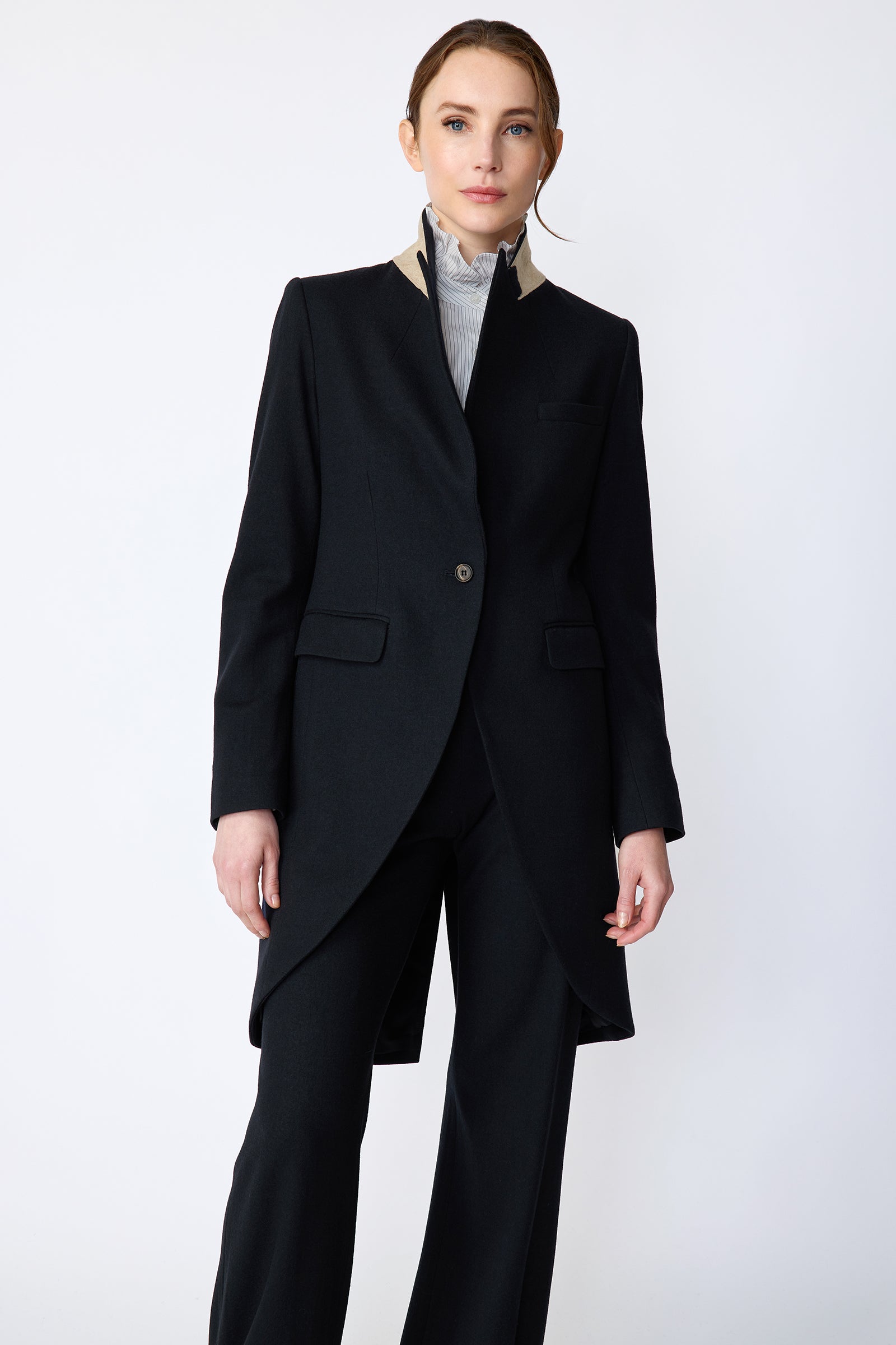 Woman wearing Kal Rieman Tailored Tux Blazer in Midnight over Kal Rieman Amy Ruffle Collar shirt with Kal Rieman felted Jersey Wide Leg pants in midnight, arms on the side