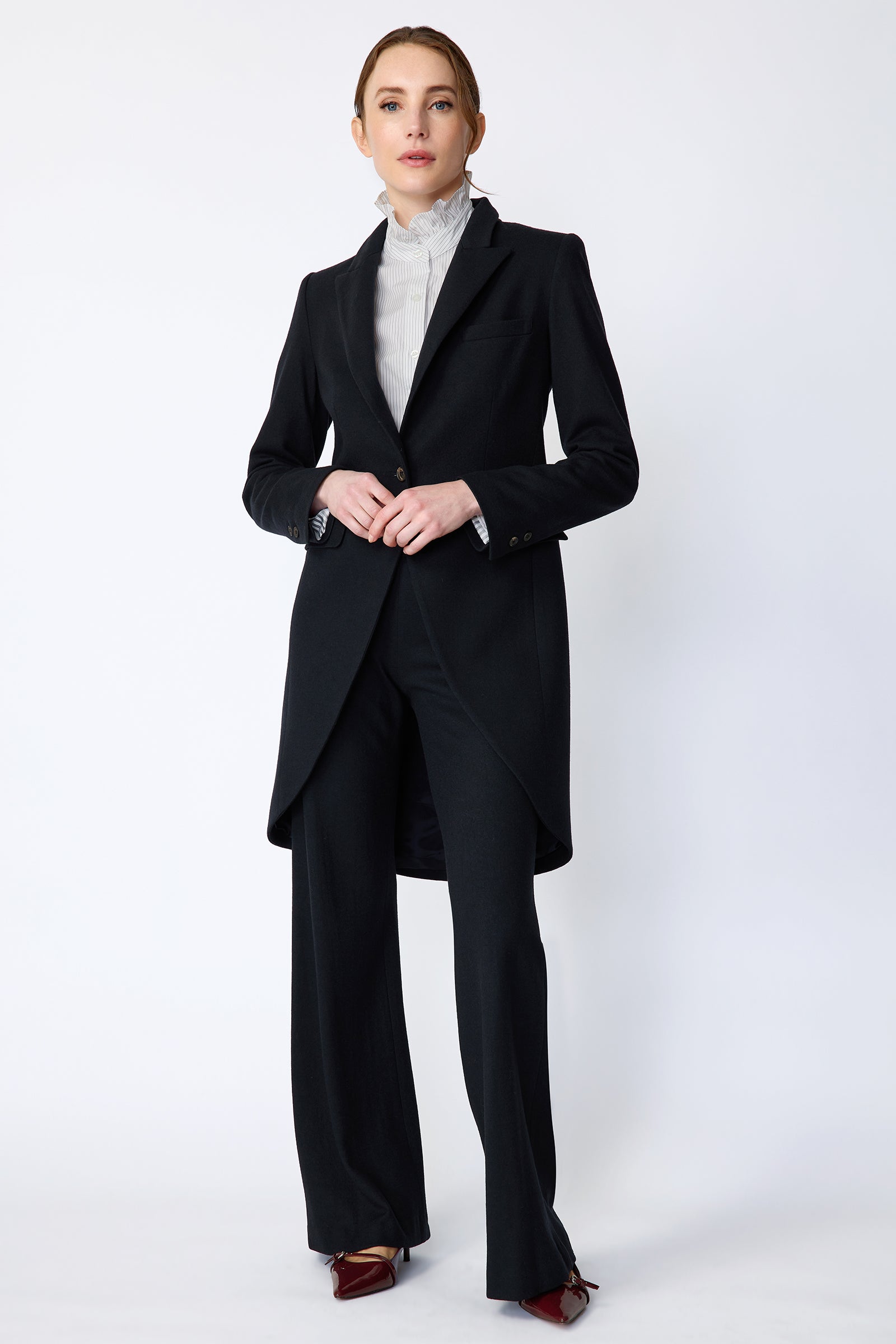 Woman wearing Kal Rieman Tailored Tux Blazer in Midnight over Kal Rieman Amy Ruffle Collar shirt with Kal Rieman felted Jersey Wide Leg pants in midnight hands held in front