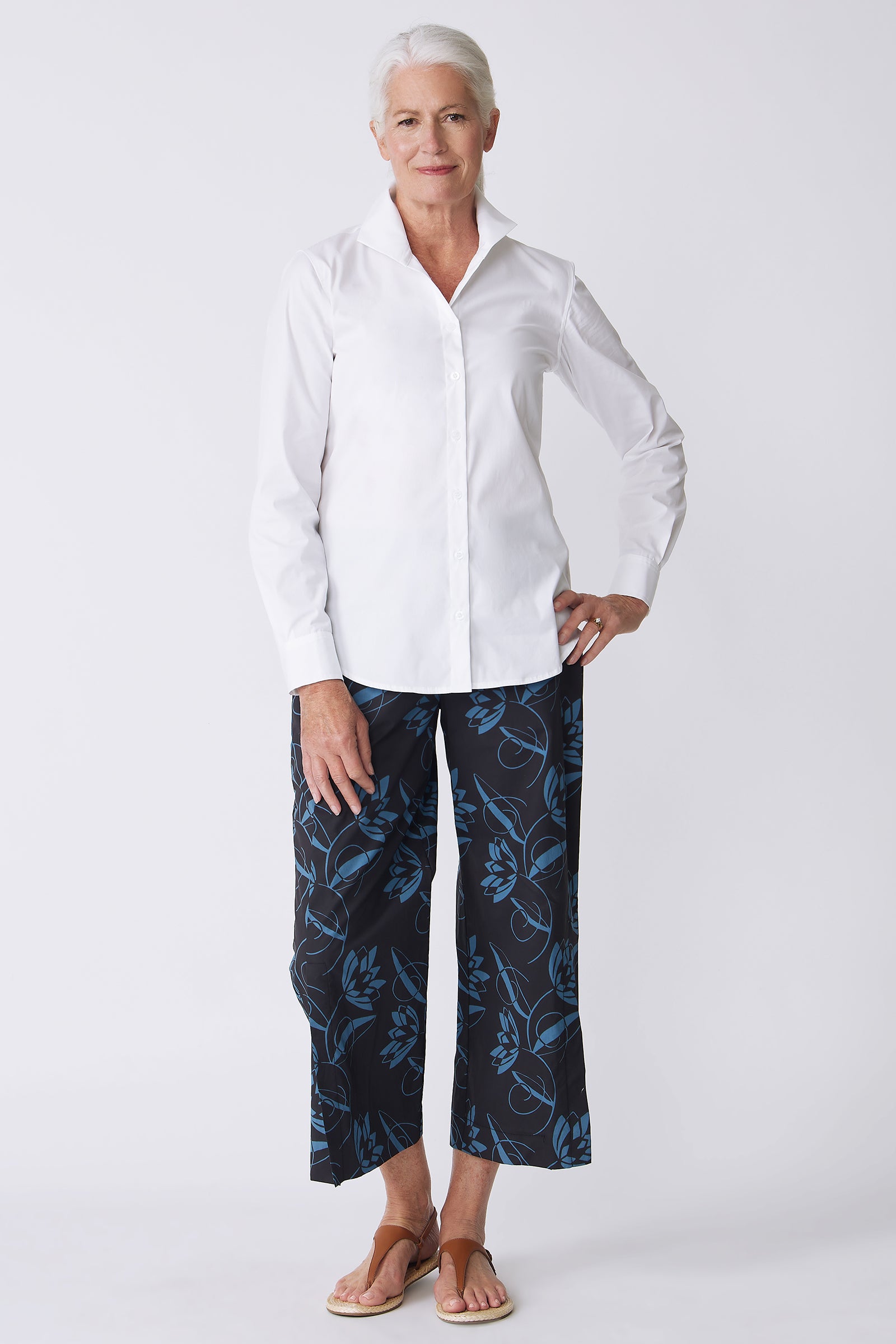 Kal Rieman Tami Side Kick Pant in Lotus Print Blue on model with left hand on hip