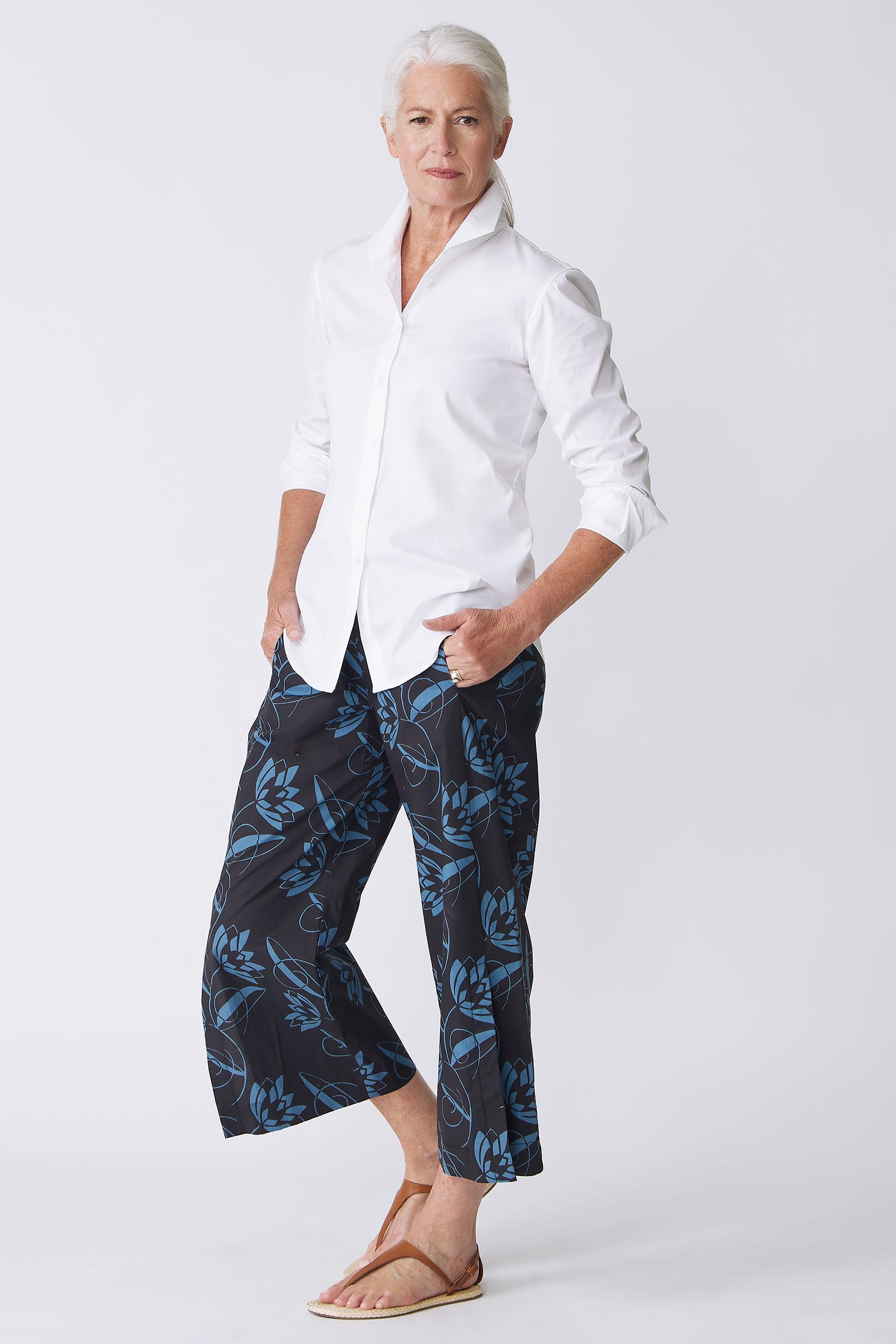 Kal Rieman Tami Side Kick Pant in Lotus Print Blue on model with hands in pockets