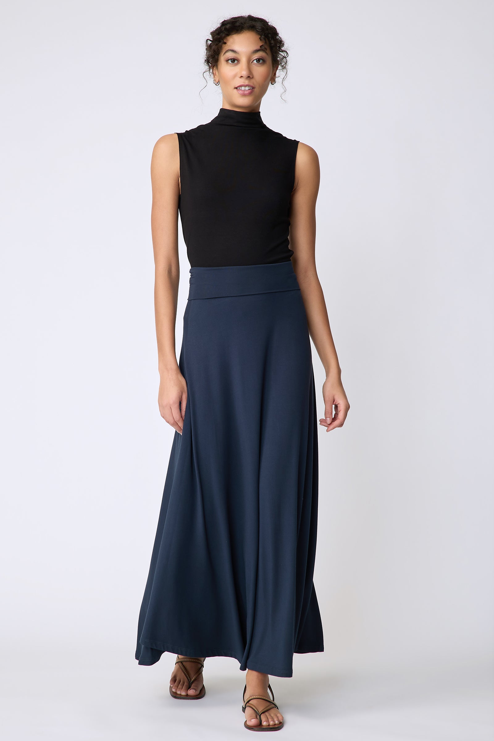 Kal Rieman Thea Kick Skirt in navy bamboo jersey on model front view walking