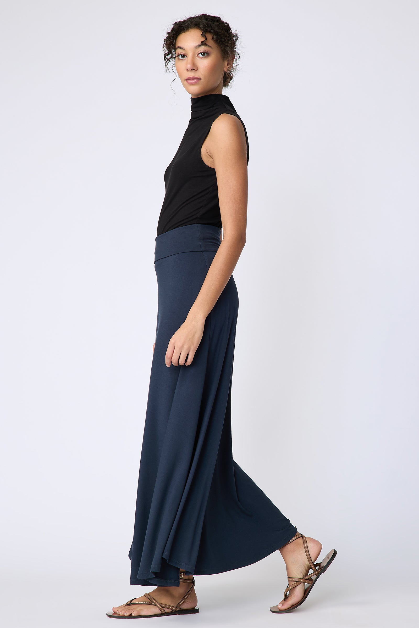 Kal Rieman Thea Kick Skirt in navy bamboo jersey on model side view walking