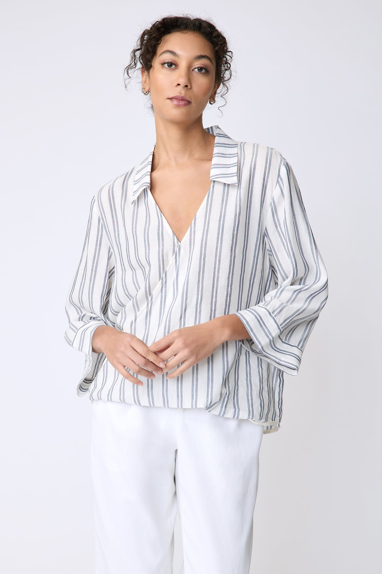 Kal Rieman Tropez Pullover in navy stripe on model front view hands in front