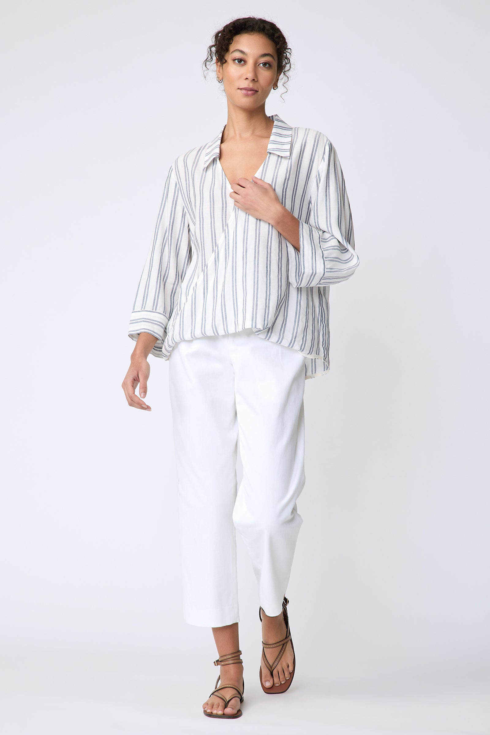 Kal Rieman Tropez Pullover in navy stripe on model front view walking