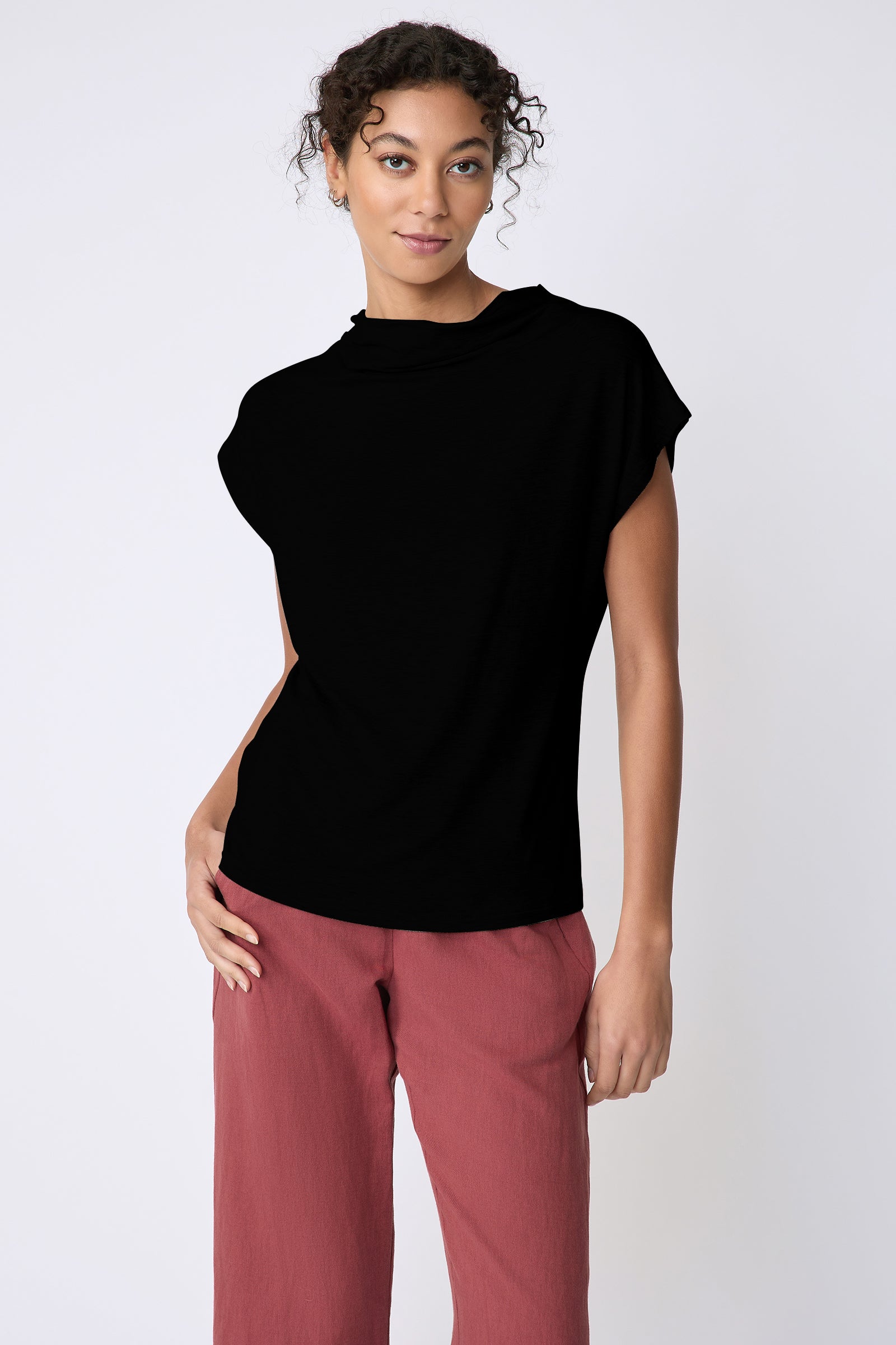 Kal Rieman Uma Funnelneck Tee in Black on model front view hand in pocket