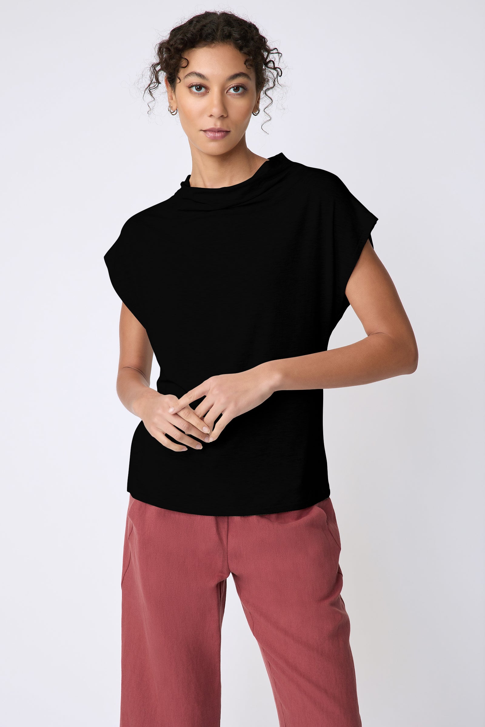 Kal Rieman Uma Funnelneck Tee in Black on model front view hands in front