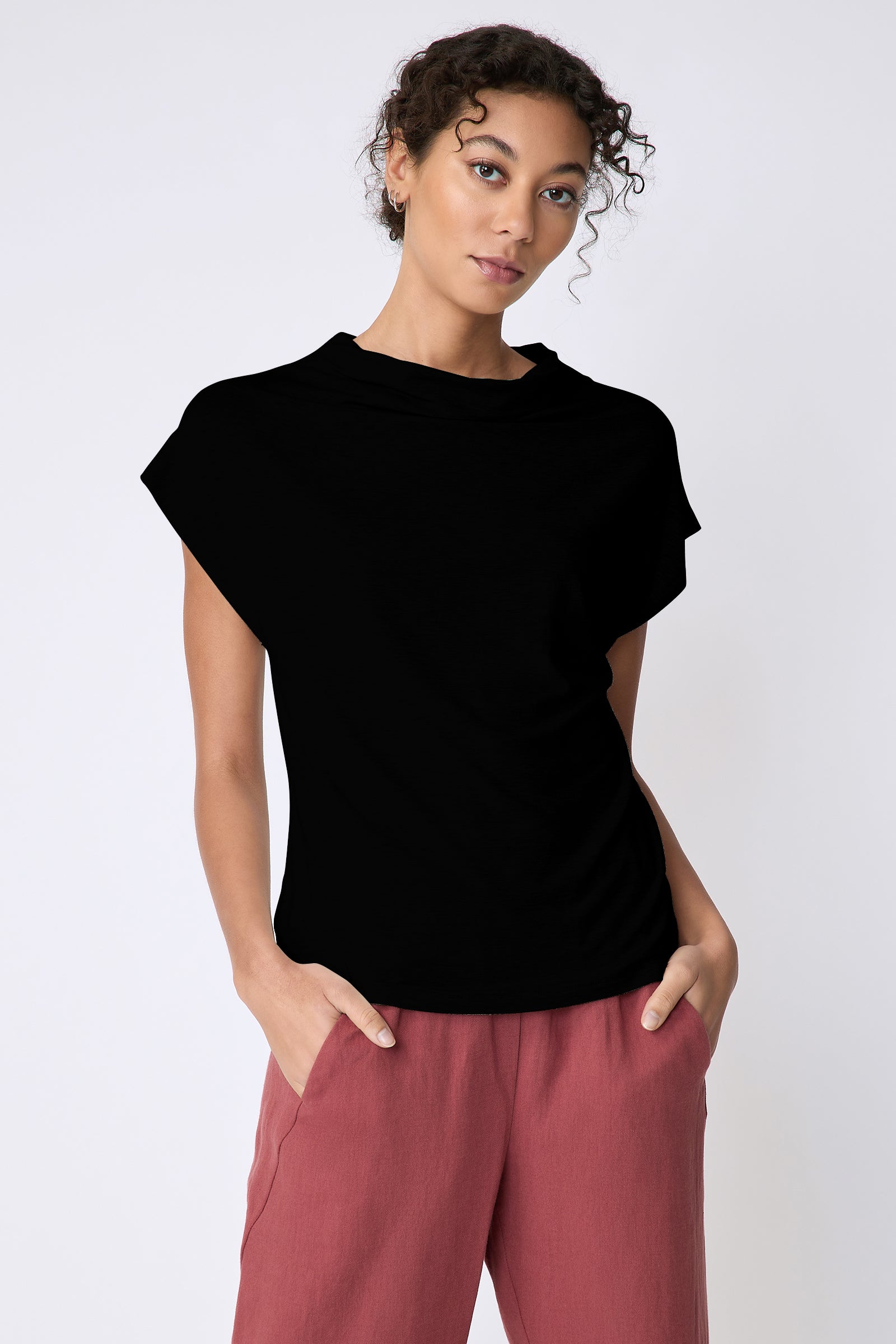 Kal Rieman Uma Funnelneck Tee in Black on model front view hands in pockets