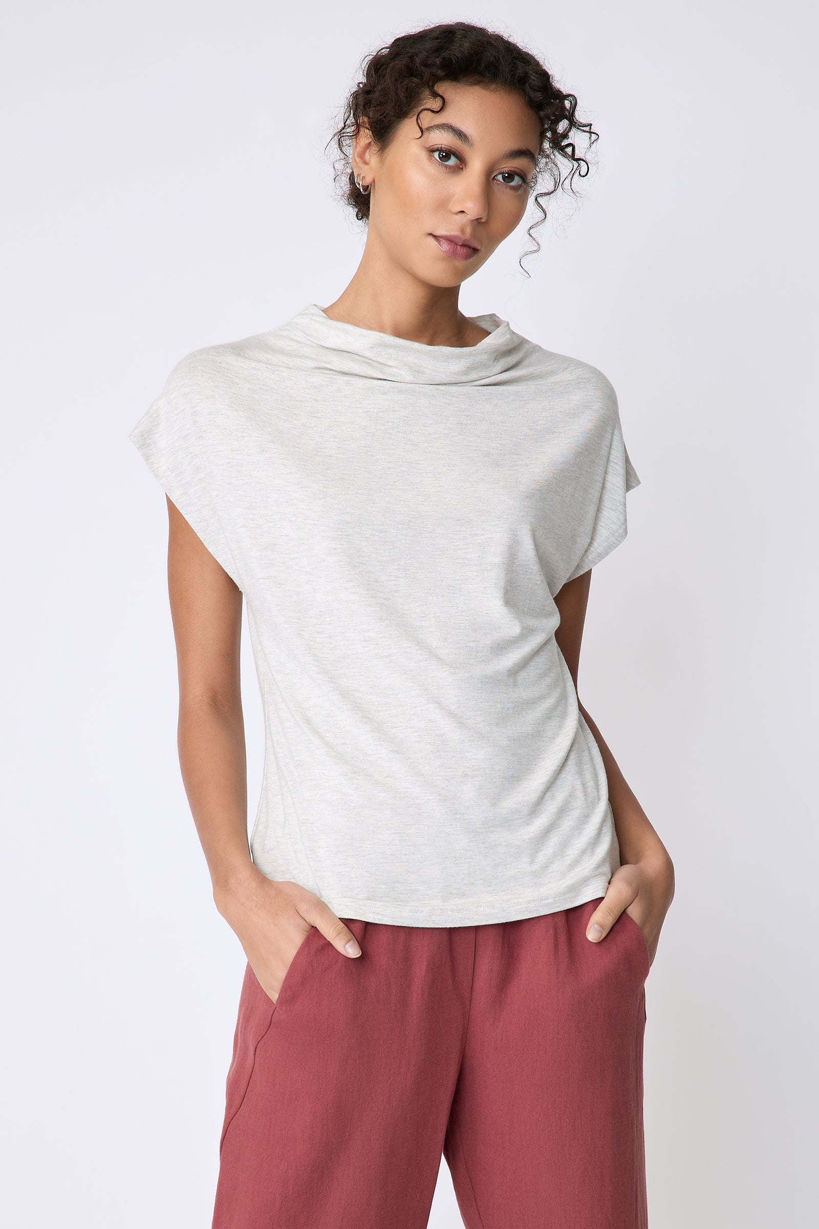 Kal Rieman Uma Funnelneck Tee in Oatmeal on model front view hands in pockets