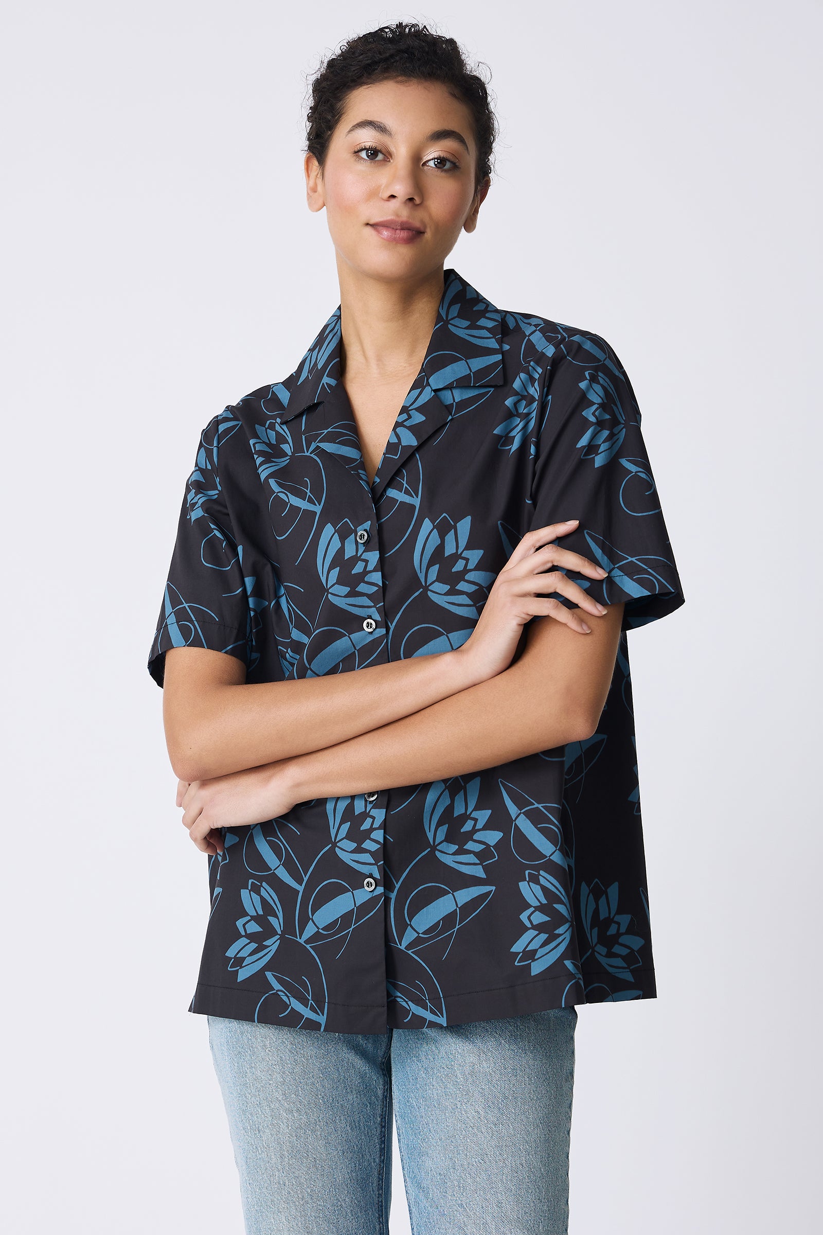 Kal Rieman Vacation Shirt in Lotus Print Blue on model with arms crossed front view