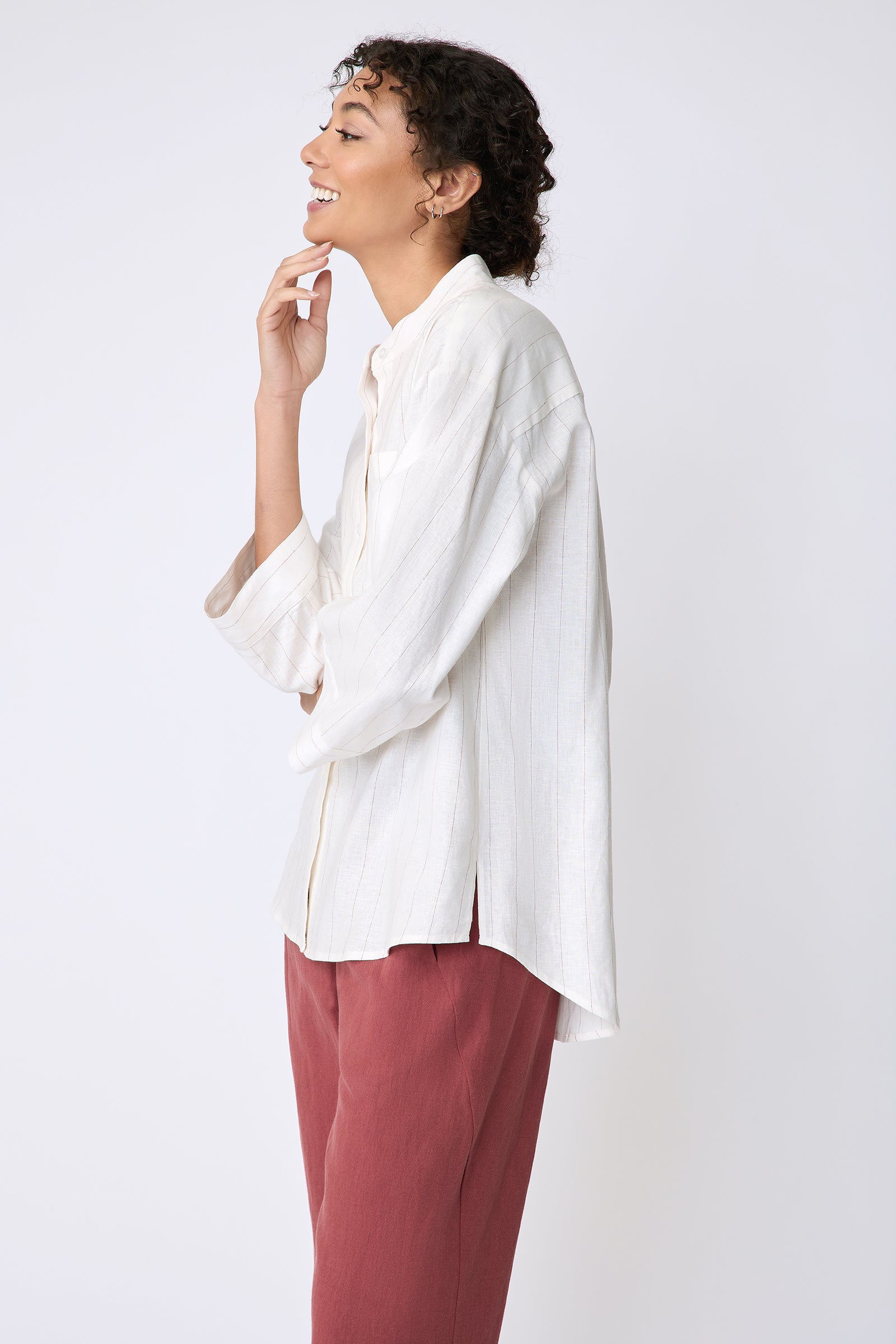Kal Rieman Valerie Top in pinstripe linen on model back side view holding chin