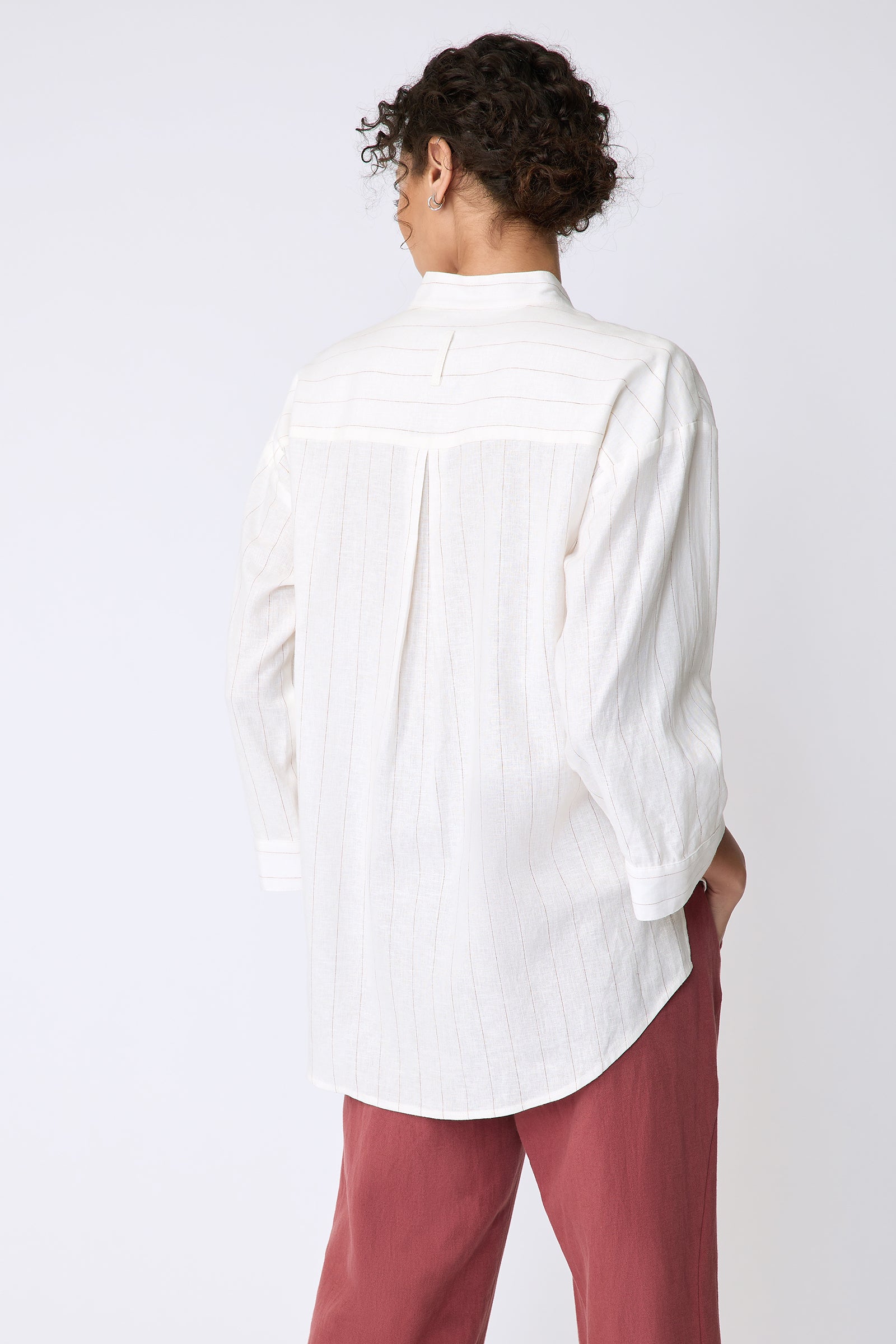 Kal Rieman Valerie Top in pinstripe linen on model back view hands in pockets