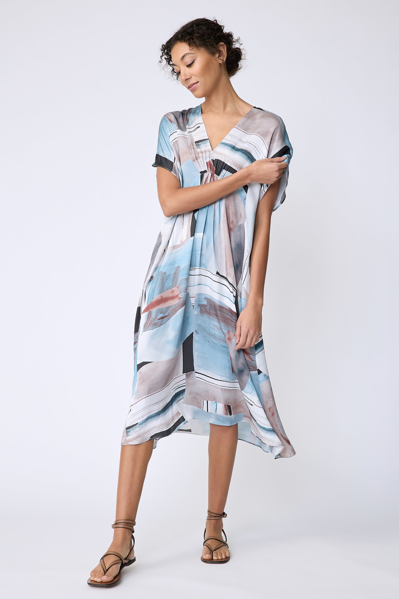 Kal Rieman Vanna Dress in Sante Fe Print blue on model front view holding sleeve