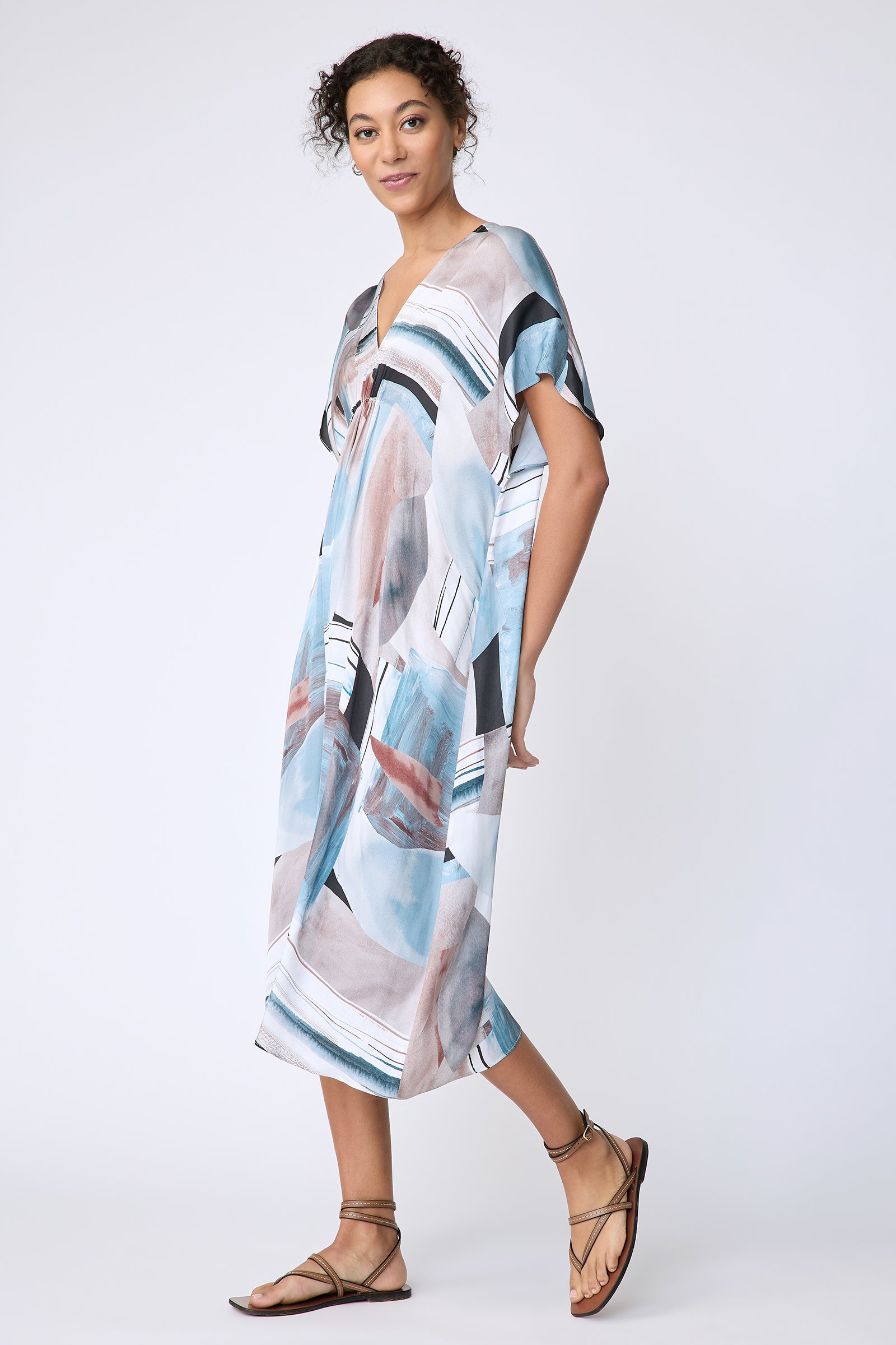 Kal Rieman Vanna Dress in Sante Fe Print blue on model side view walking