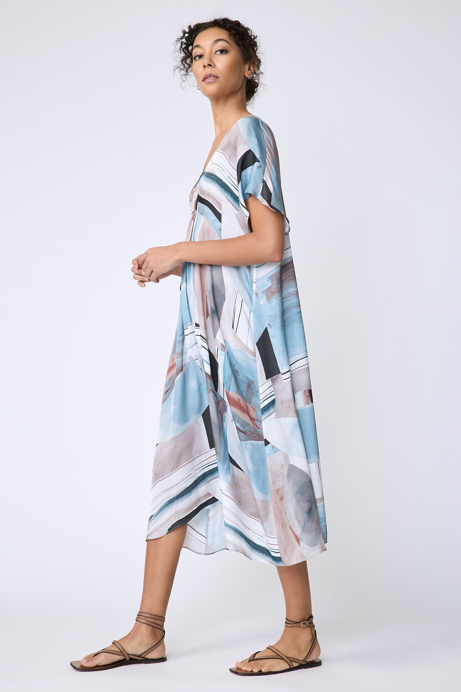 Kal Rieman Vanna Dress in Sante Fe Print blue on model side view walking