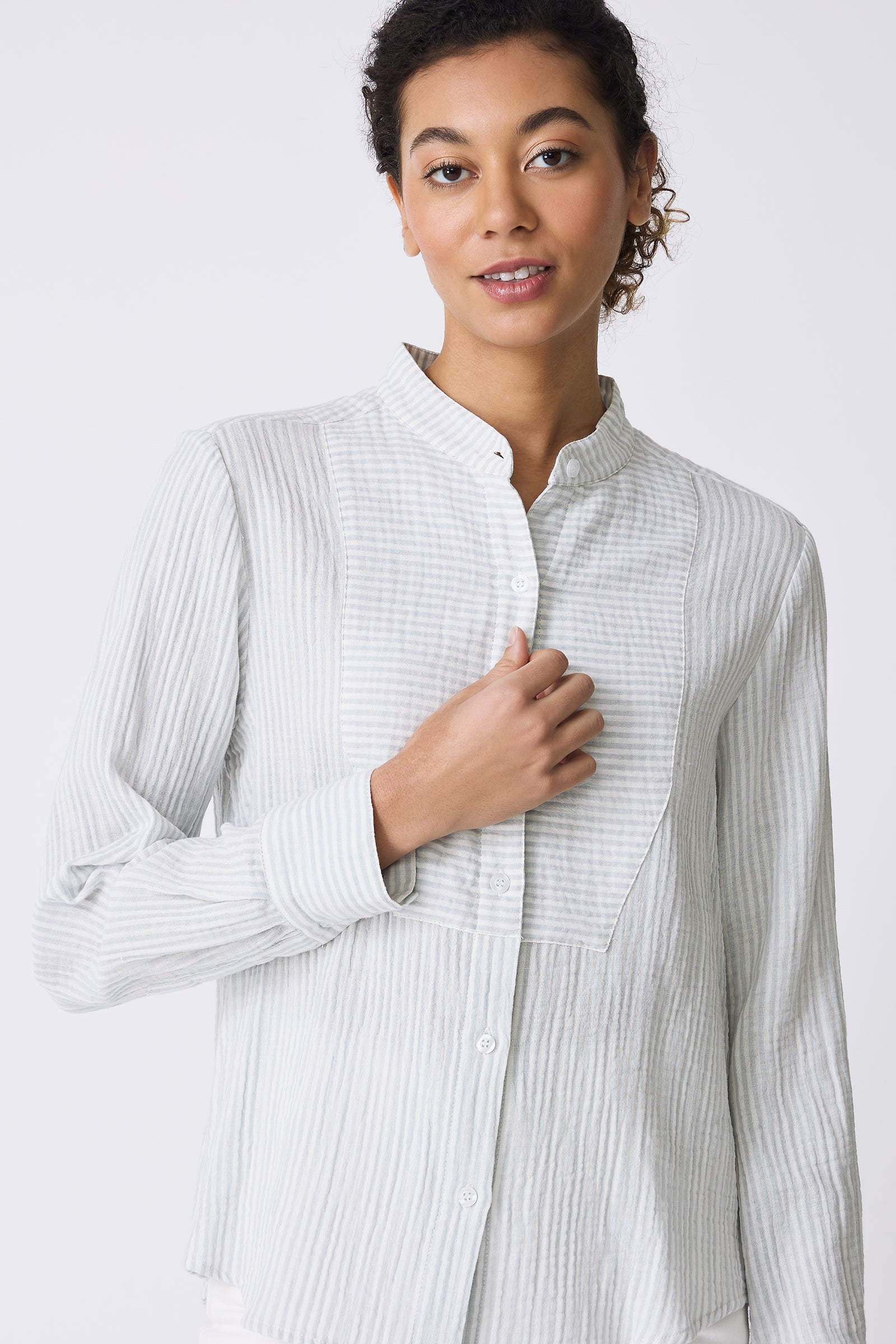 Kal Rieman Vera Tux Shirt in Blue Stripe on model touching shirt front view