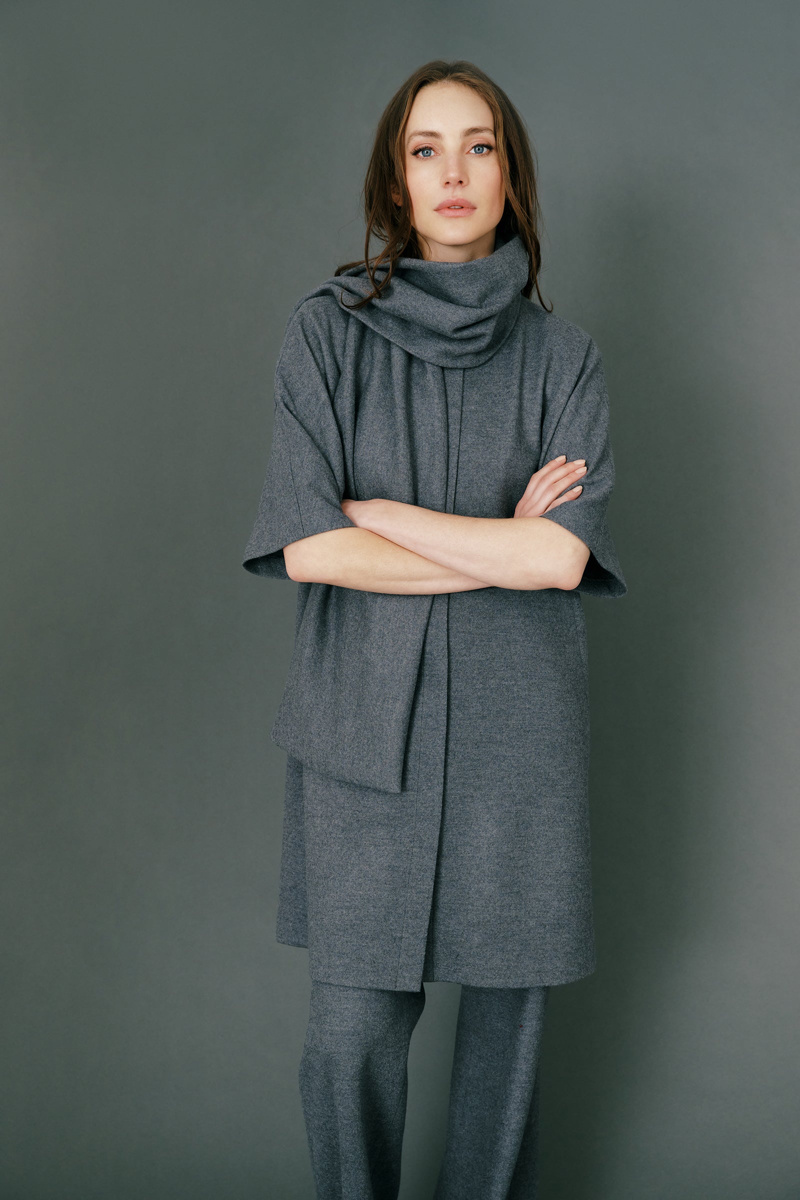 Woman wearing Kal Rieman York Cardigan  in Grey Italian Felted Jersey with Kal Rieman Felted Jersey Wide Leg pants in Grey italian Felted Jersey and burgundy shoes, hands in poket, full front view