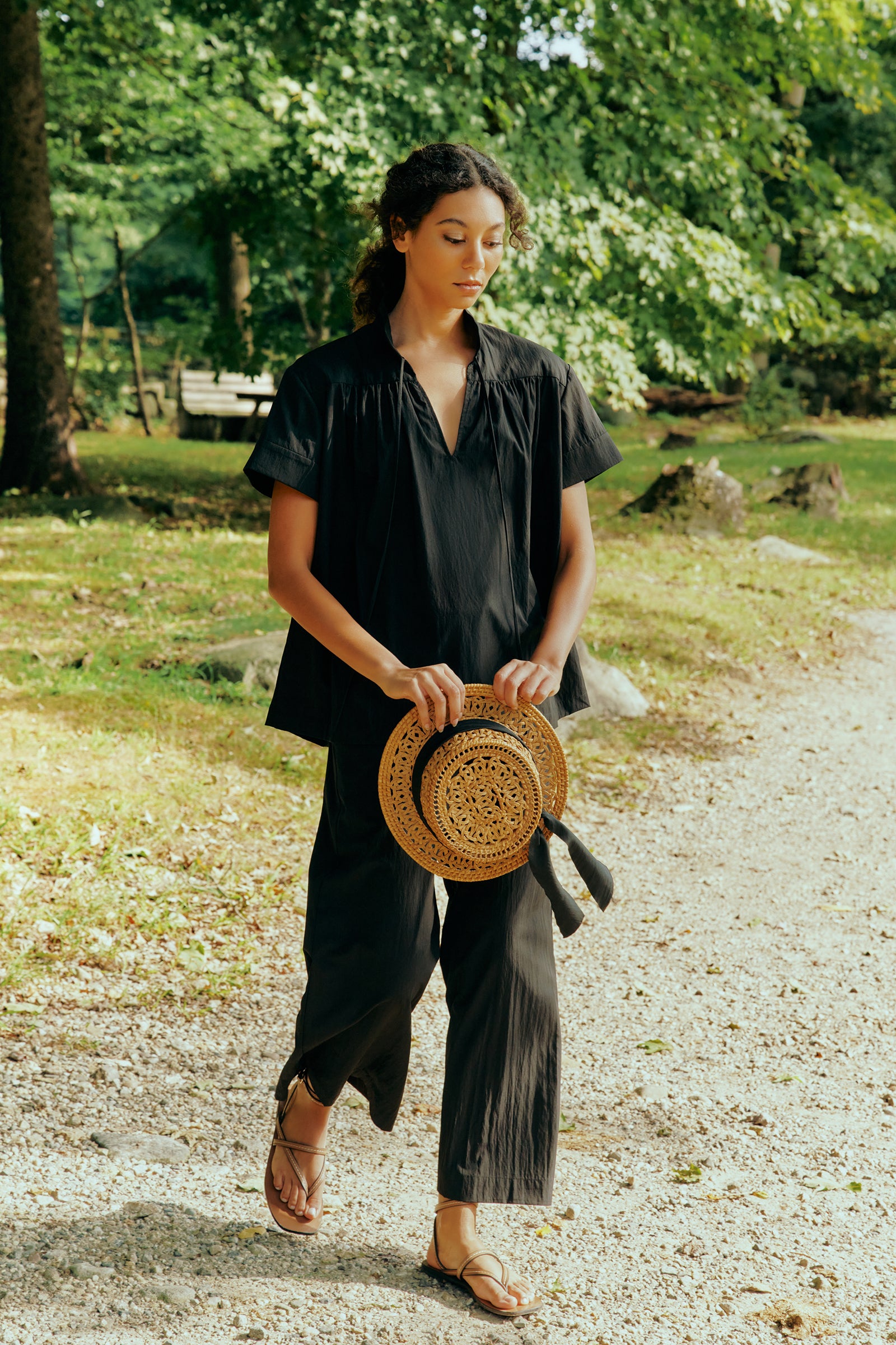 Kal Rieman Camille Top in black typewriter cloth on model front view hands in pockets