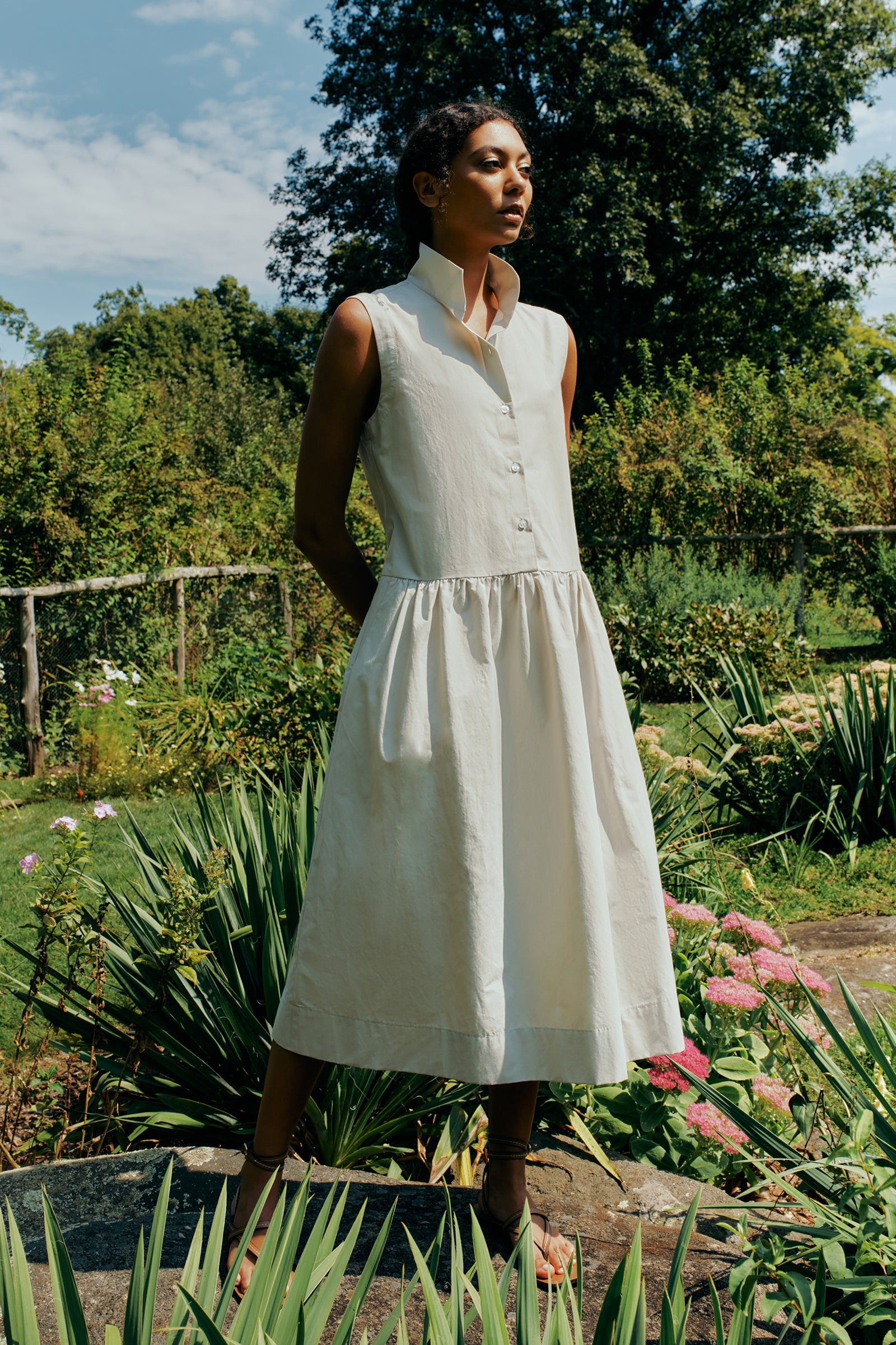 Kal Rieman Demi Dress in Italian  Broadcloth stone color on model front view hands in pockets