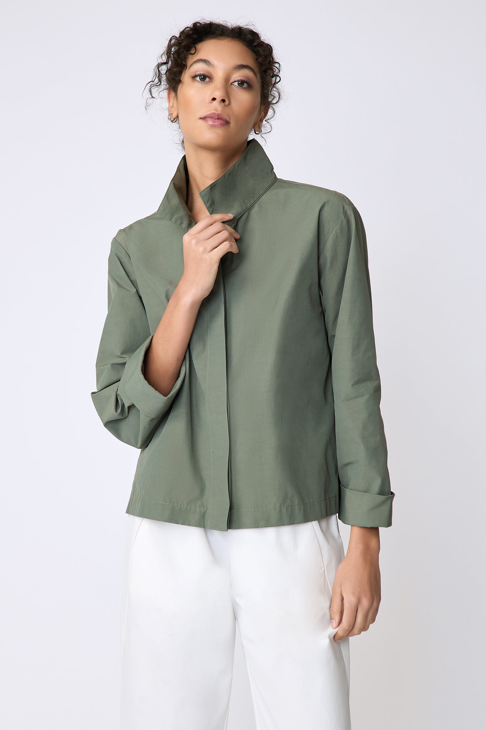 Peggy jacket in Italian Broadcloth in color cactus on model front view holding collar