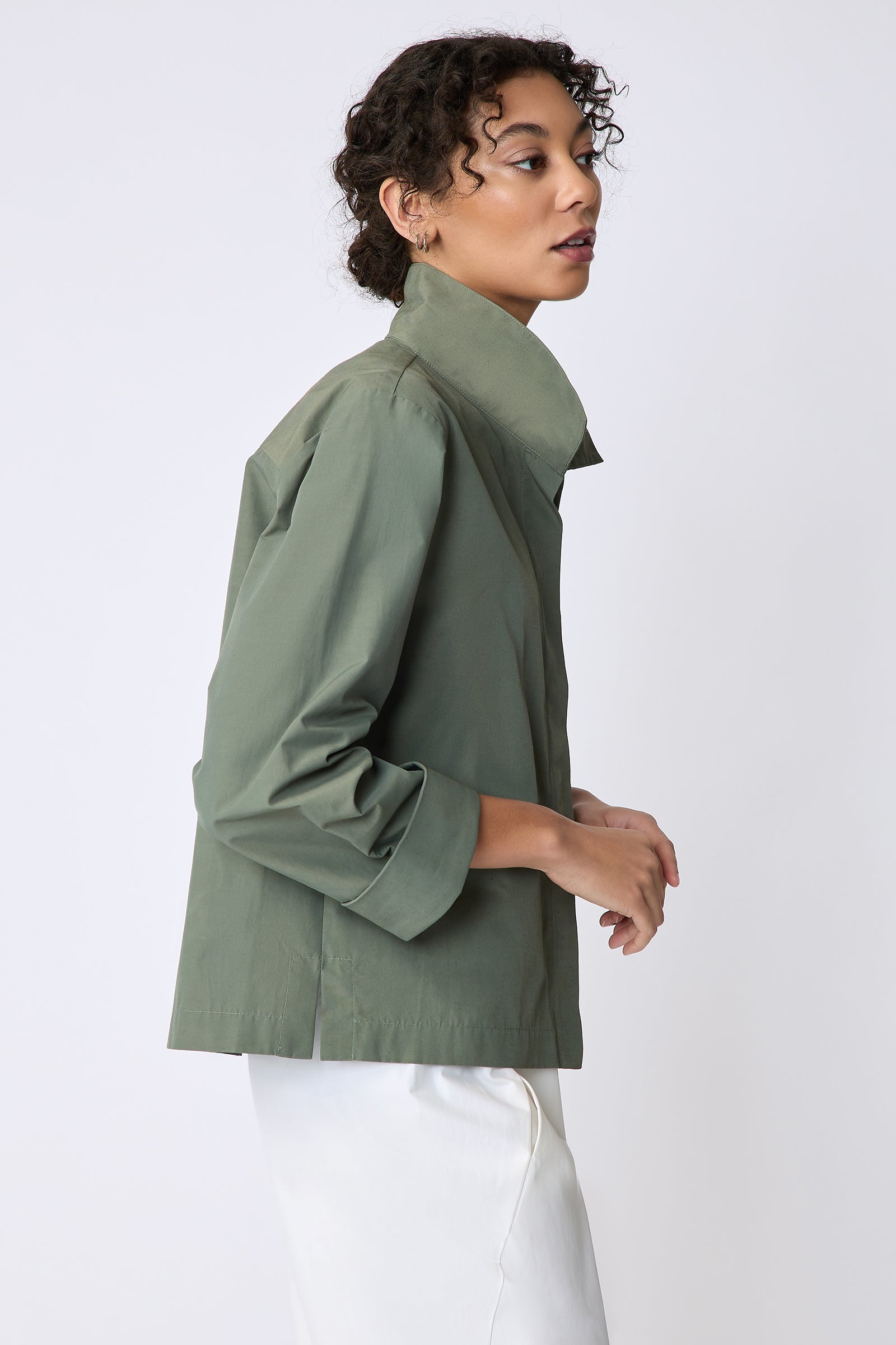 Peggy jacket in Italian Broadcloth in color cactus on side view hands in front