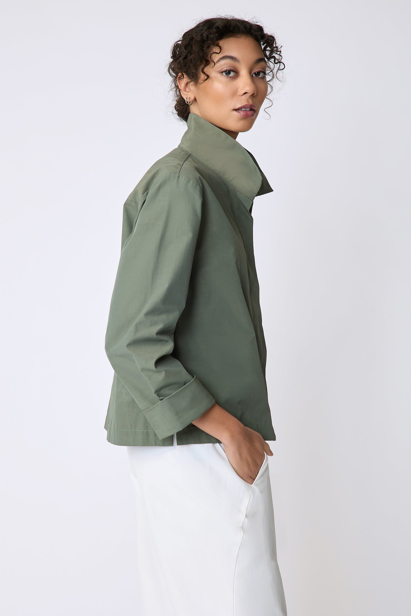 Peggy jacket in Italian Broadcloth in color cactus on side view hands in pockets