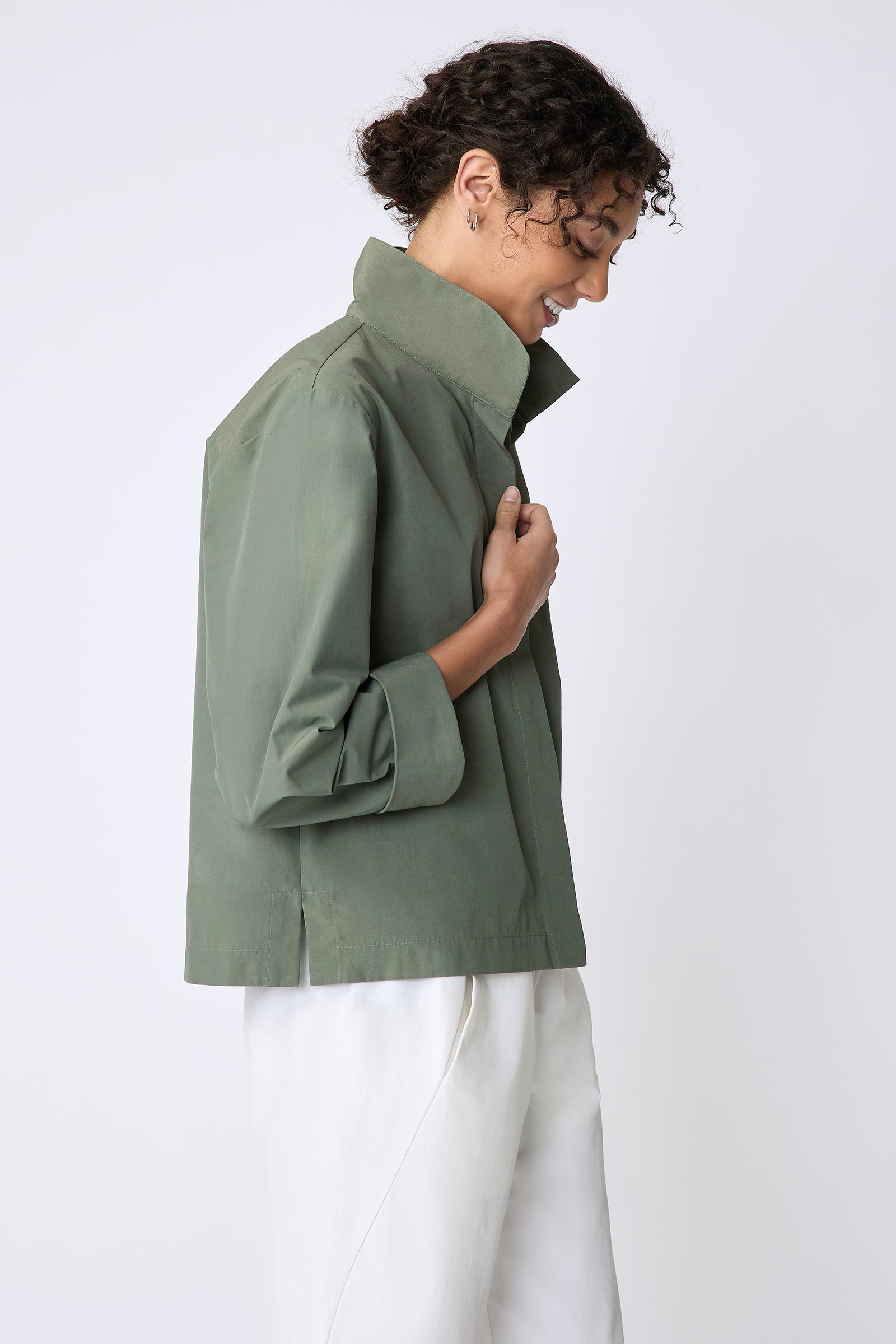 Peggy jacket in Italian Broadcloth in color cactus on side view holding lapel