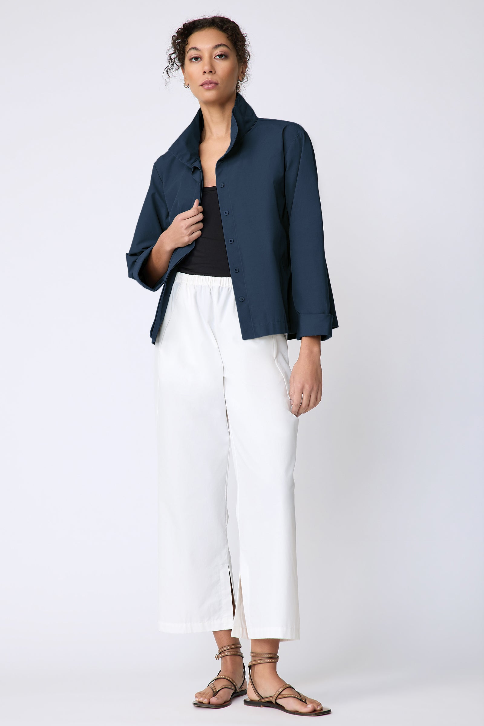 Peggy jacket in Italian Broadcloth in color summer navy on model front view full look holding placket