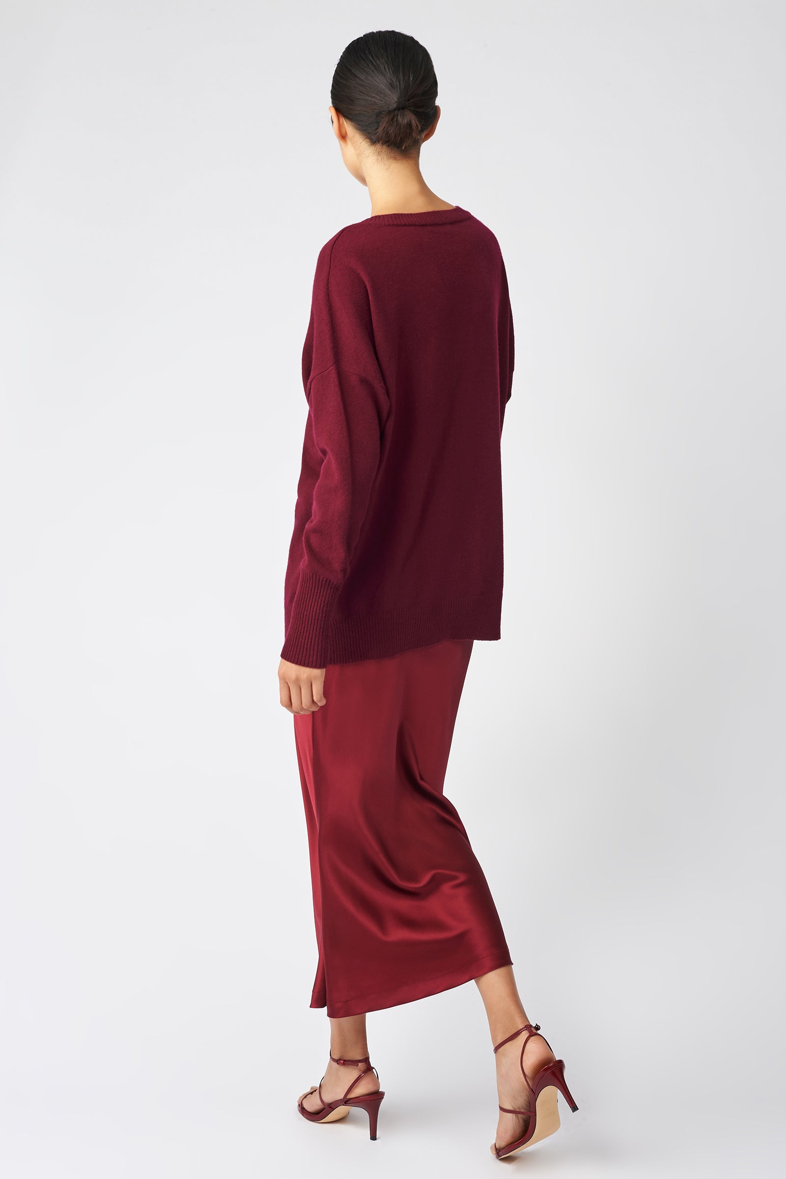 Kal Rieman Bias Silk Skirt in bordeaux on model back view walking