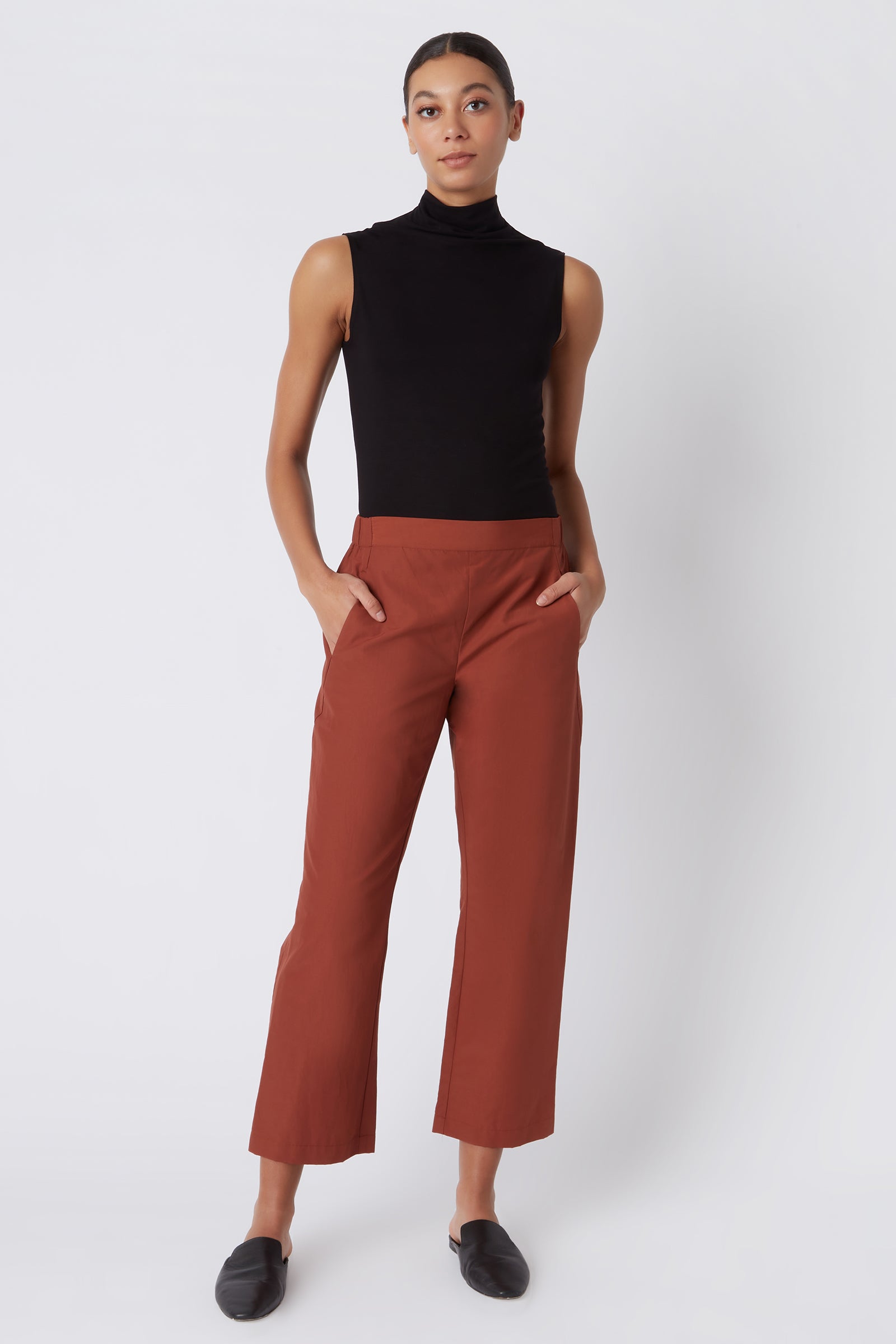 Kal Rieman Brit Crop Pant in Rust Italian Broadcloth on Model with Hands in Pocket Full Front View