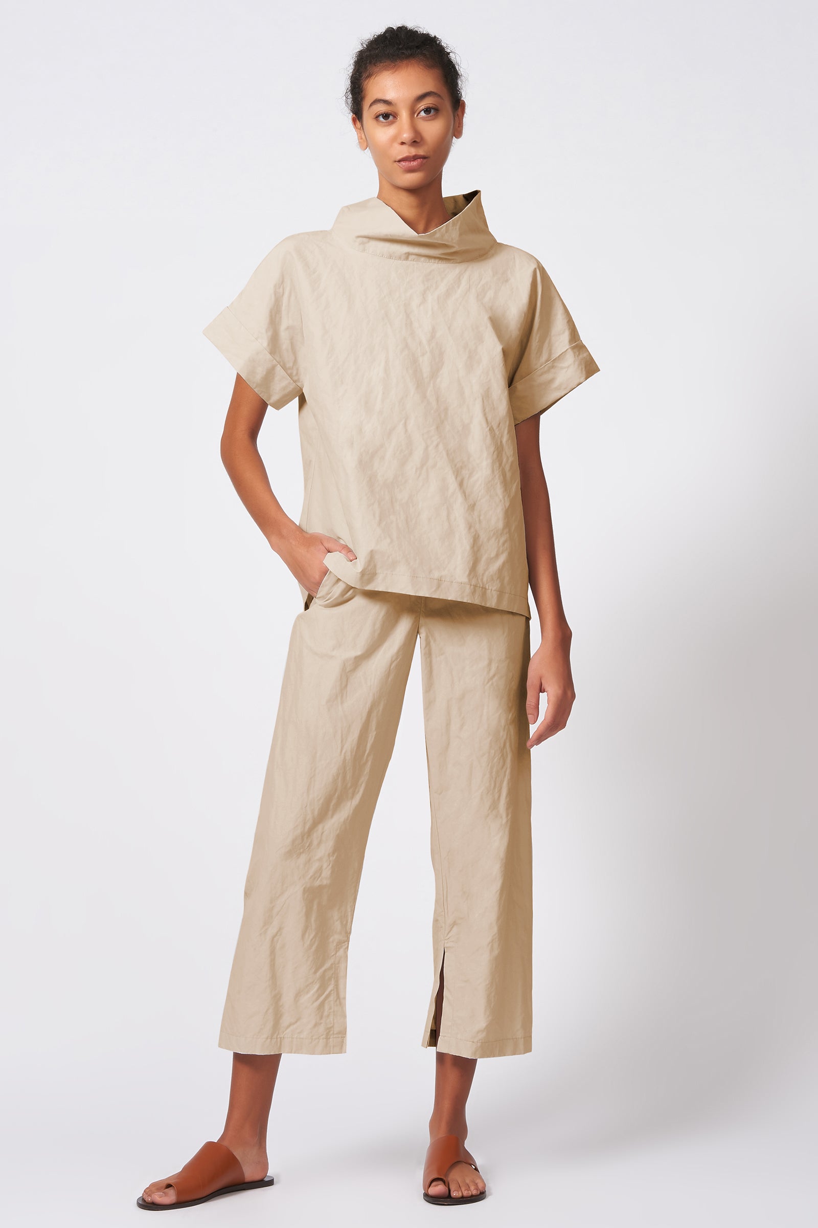 Kal Rieman Cuff Kimono Tee in khaki Italian cotton nylon on model standing with hands in pockets