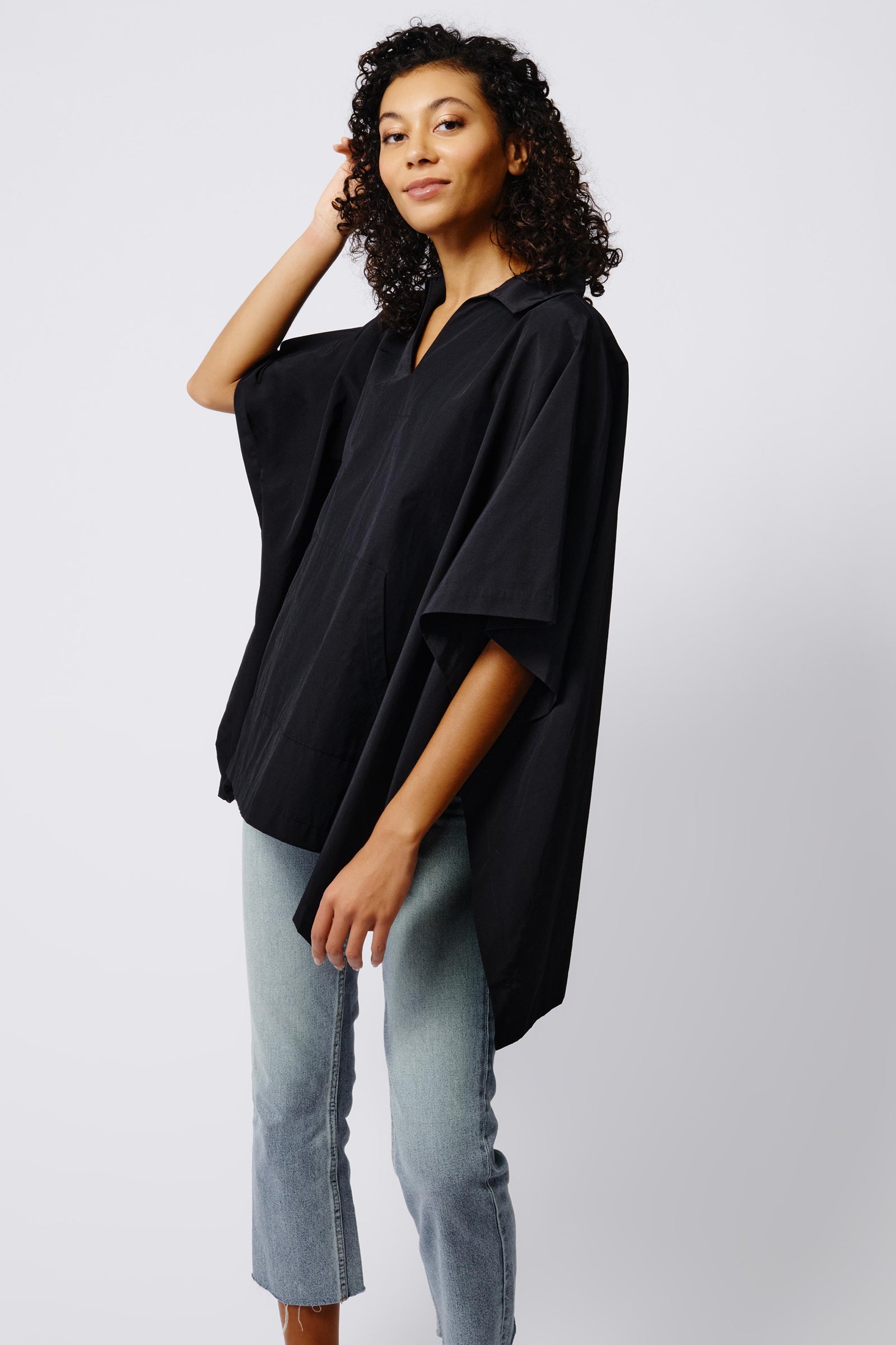Kal Rieman Gene Pocket Poncho in Black on Model Side View Crop