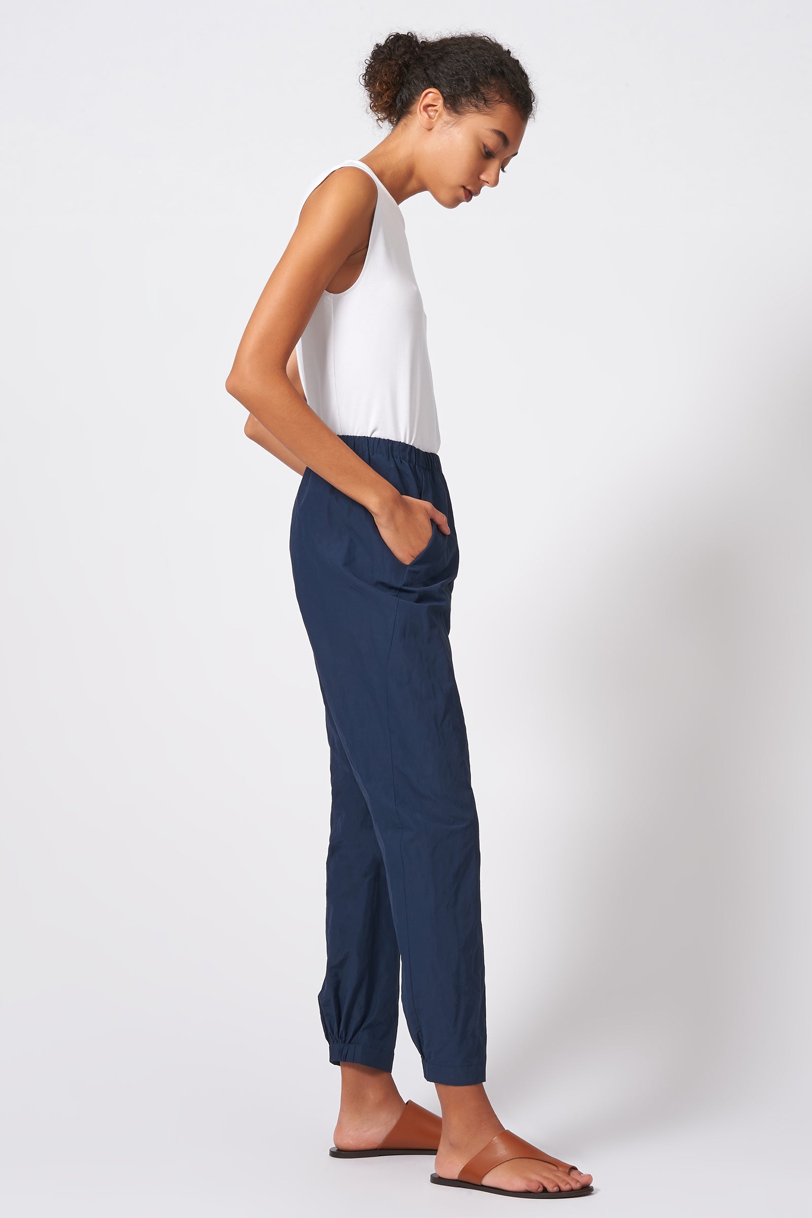 Kal Rieman Angle Seam Jogger in Navy Cotton Nylon on Model Full Side View