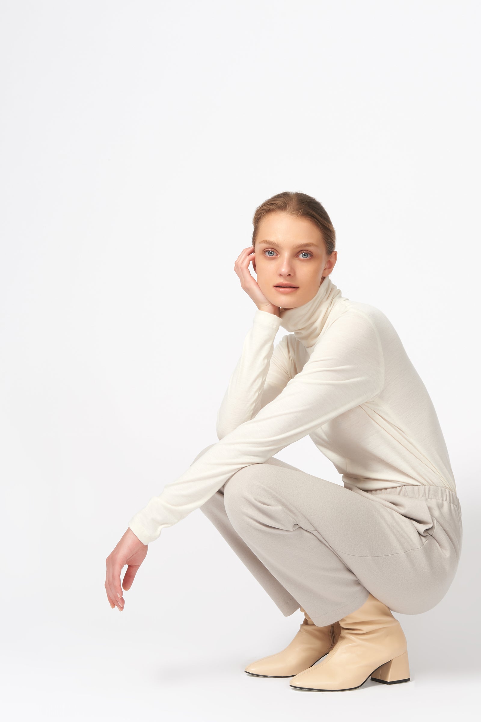 Kal Rieman Felted Jersey Angle Seam Jogger in Mink on Model Crouching Down