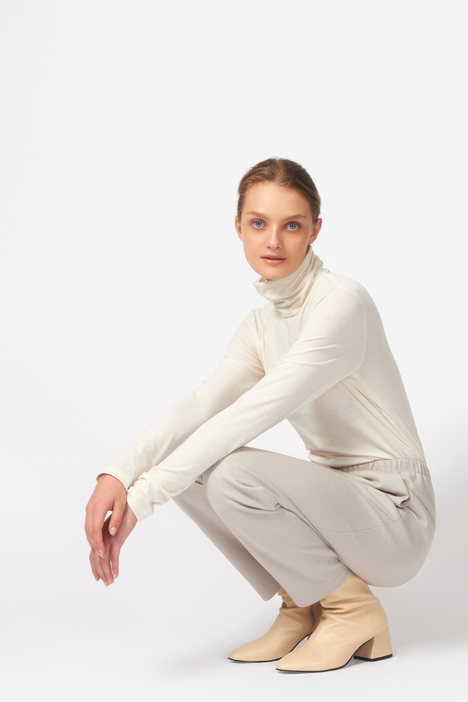 Kal Rieman Felted Jersey Angle Seam Jogger in Mink on Model Crouching Down