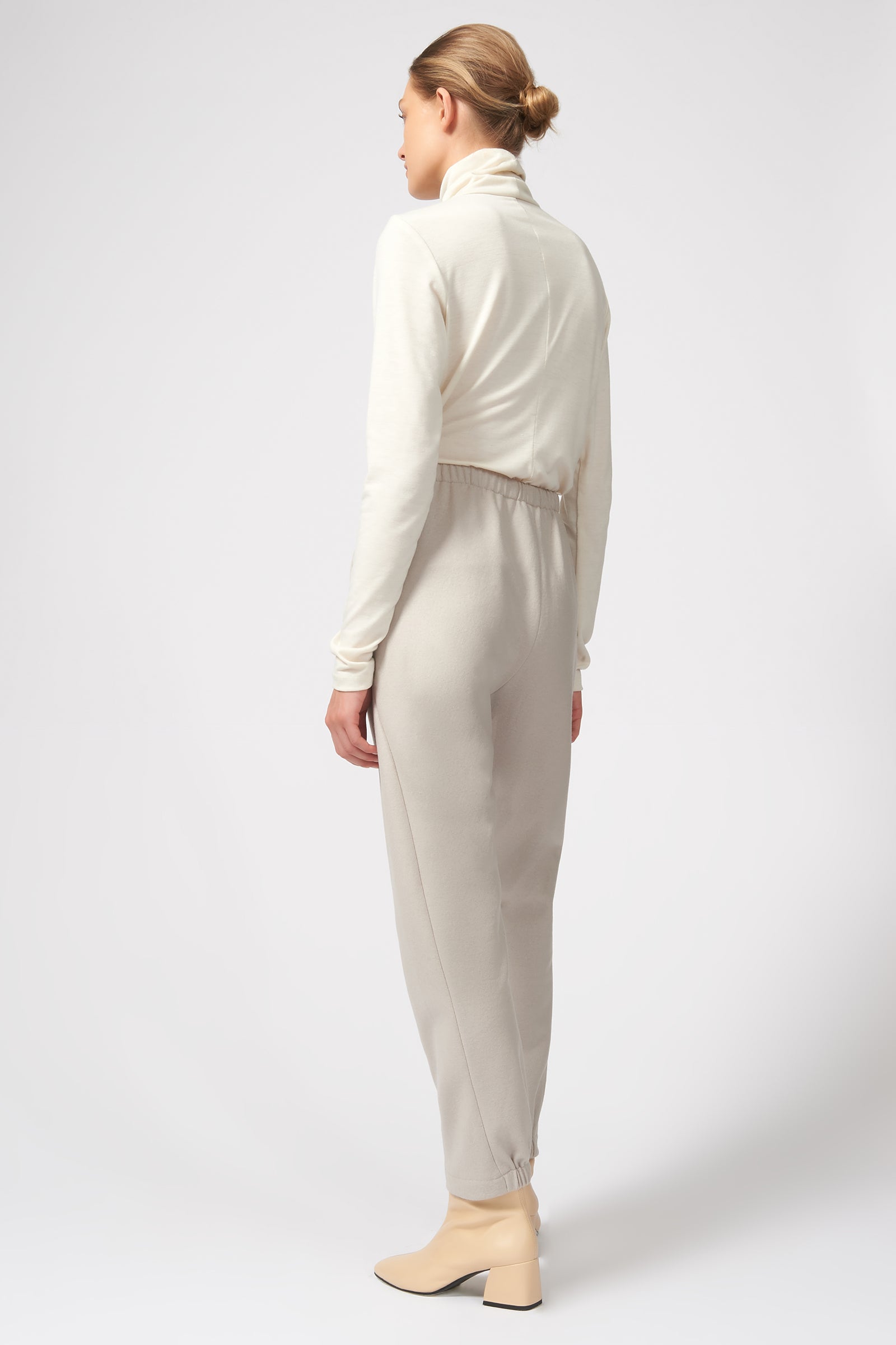 Kal Rieman Felted Jersey Angle Seam Jogger in Mink on Model Crouching Down