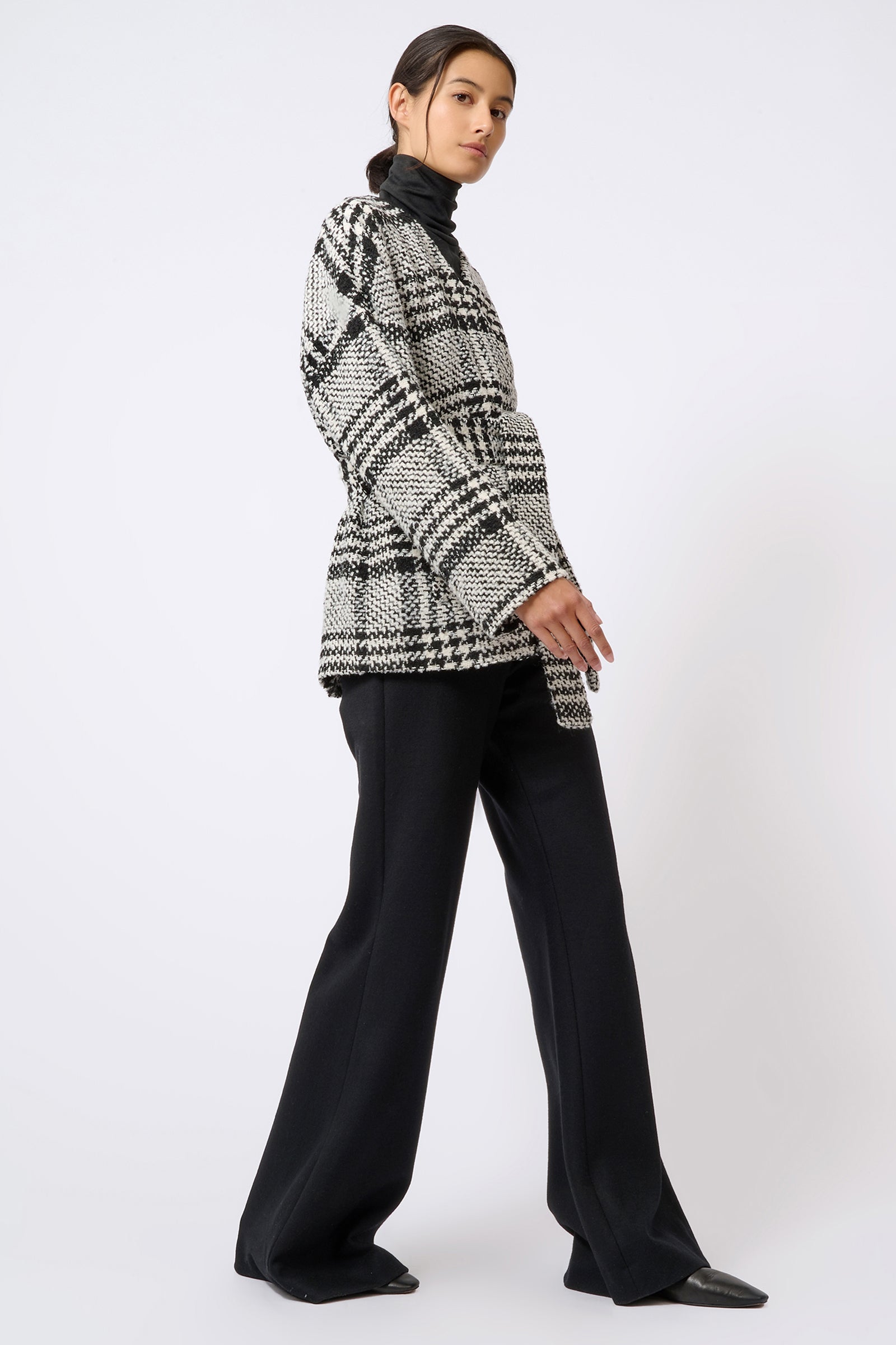 Kal Rieman Belted Cardigan in Black and White Plaid on Model Walking Full Side View