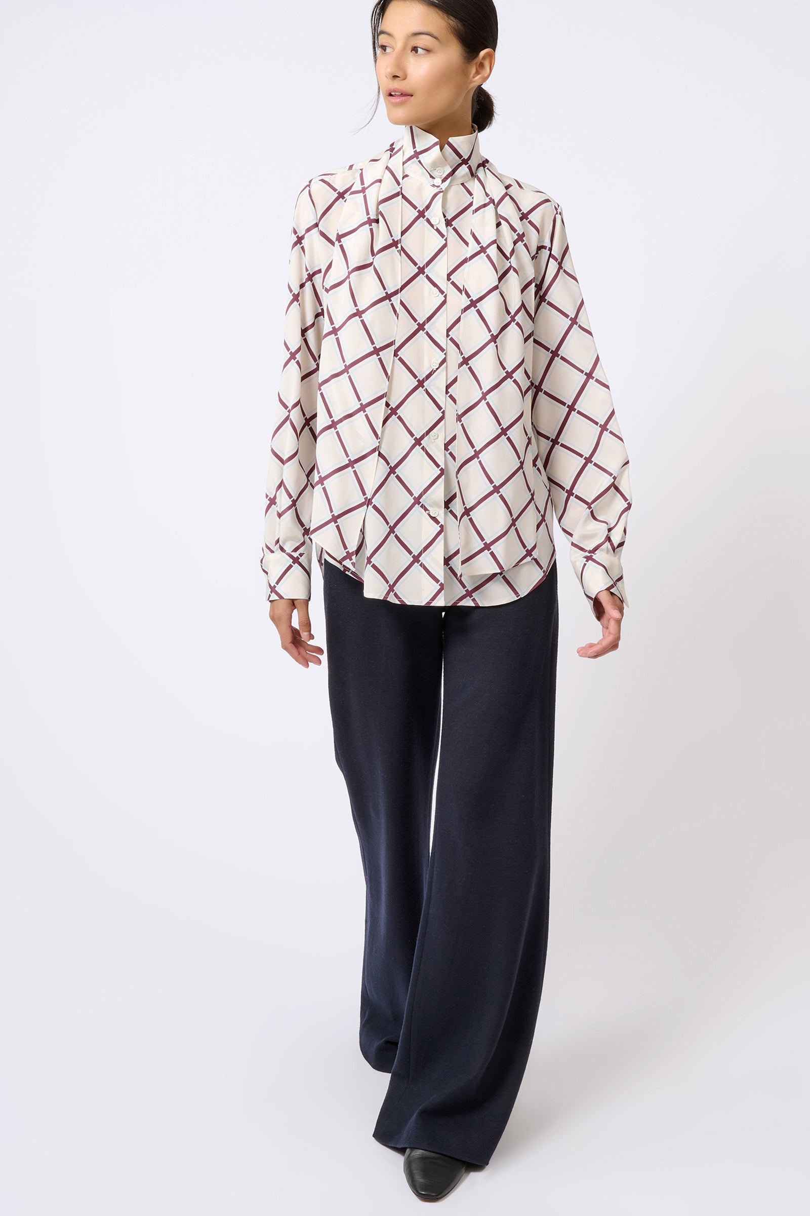 Kal Rieman Scarf Tie Blouse in Diagonal Print on Model Walking Full Front View