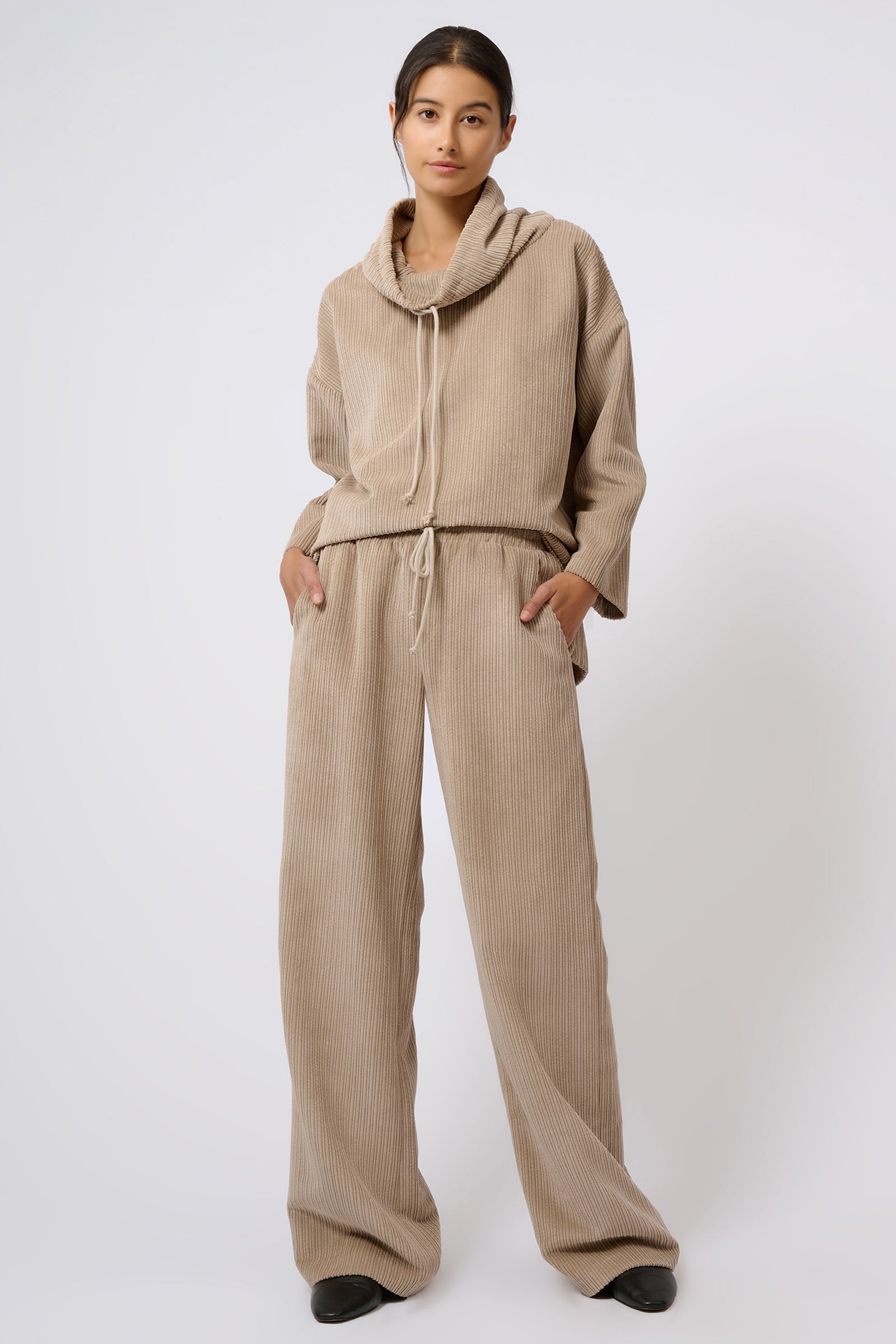 Kal Rieman Debbie Drawstring Pant in Beige on Model with Hands in Pockets Full Front View