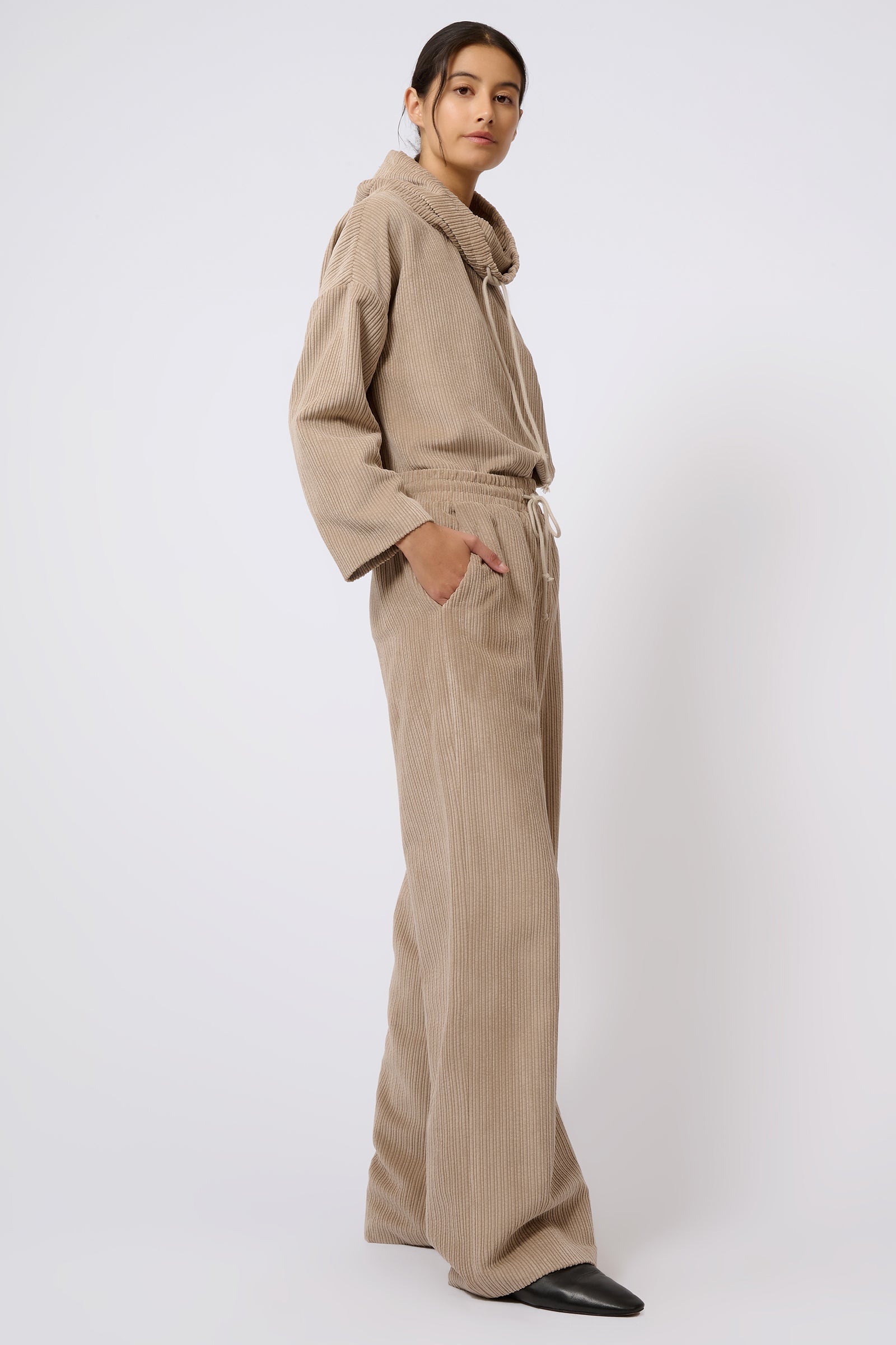 Kal Rieman Debbie Drawstring Pant in Beige on Model with Hand in Pocket Full Side View