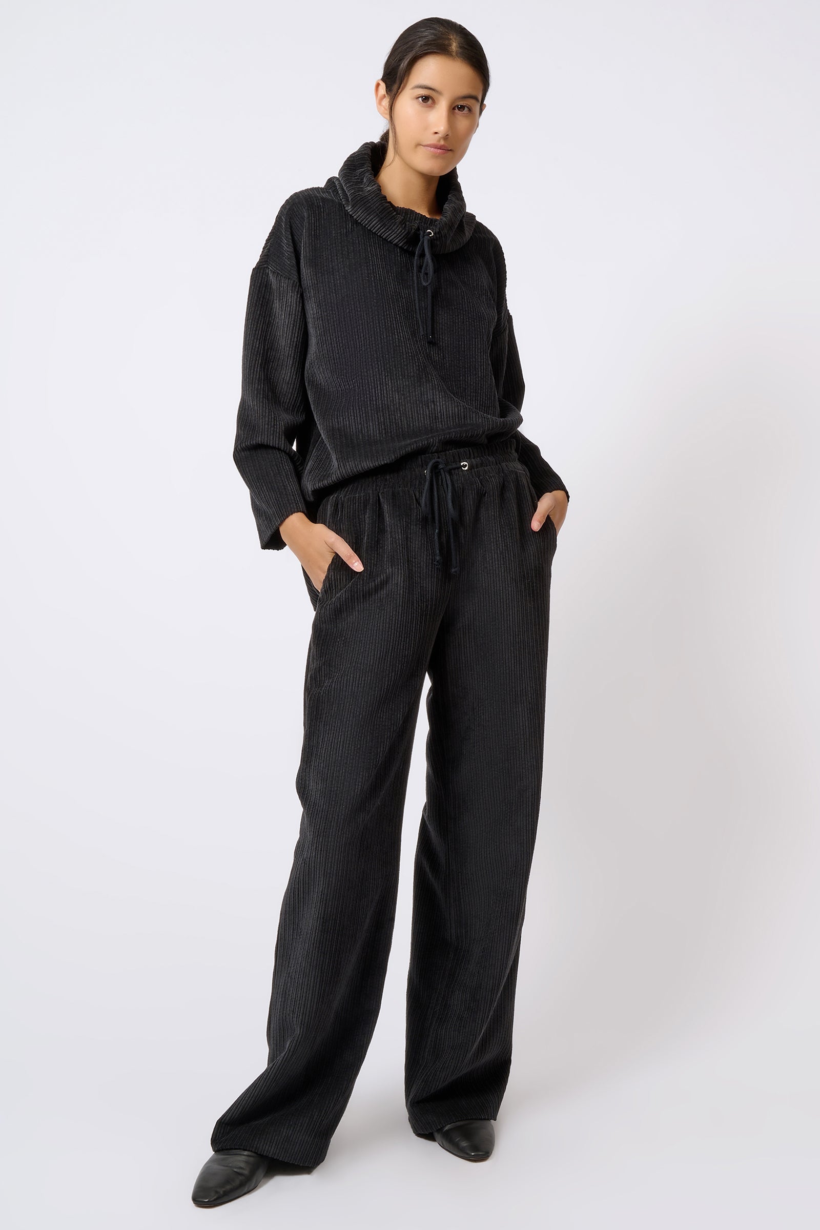 Kal Rieman Debbie Drawstring Pant in Black on Model Hand in Pocket Full Front View